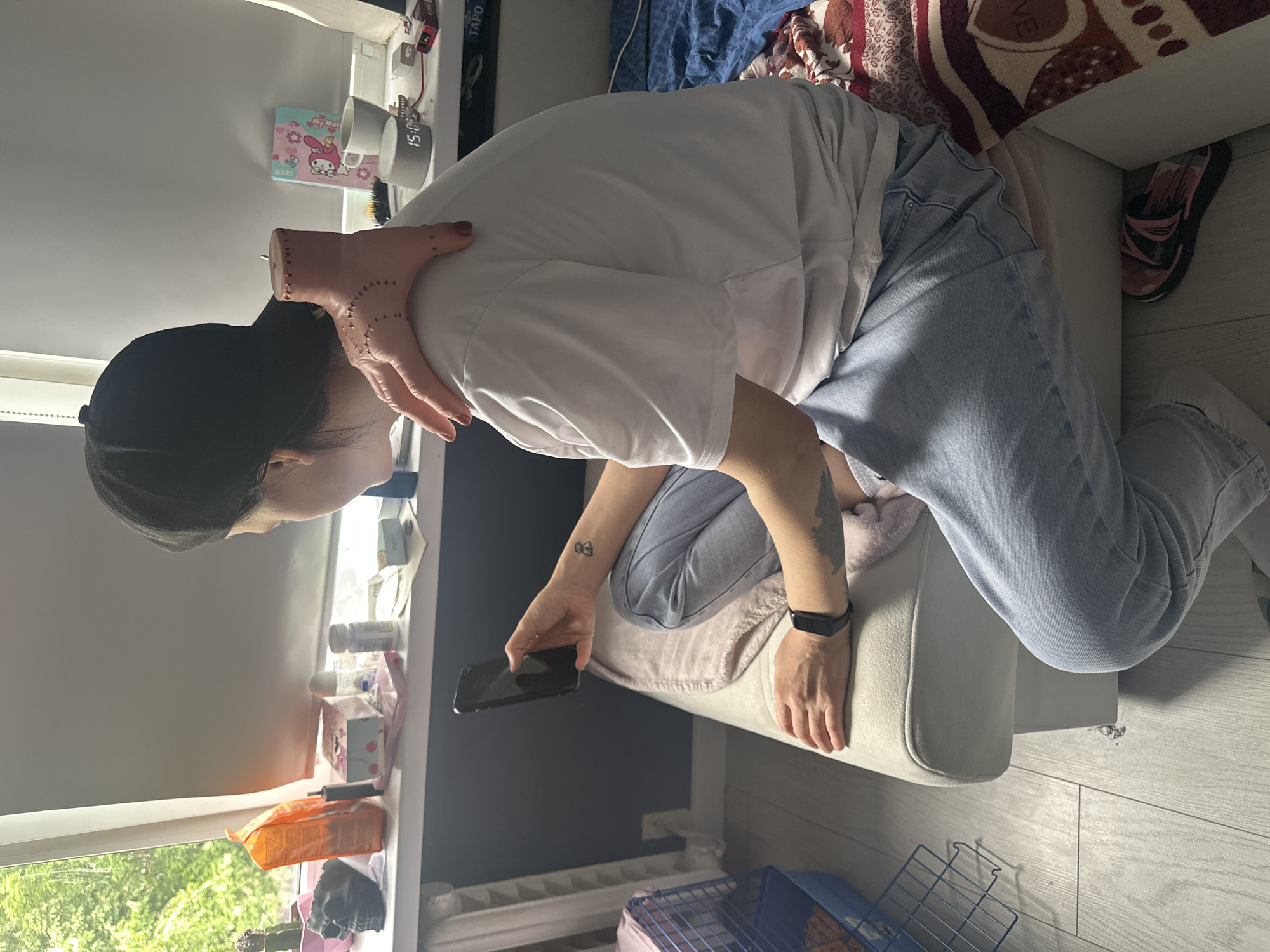 Person with smartphone observed on ottoman in Stavropol