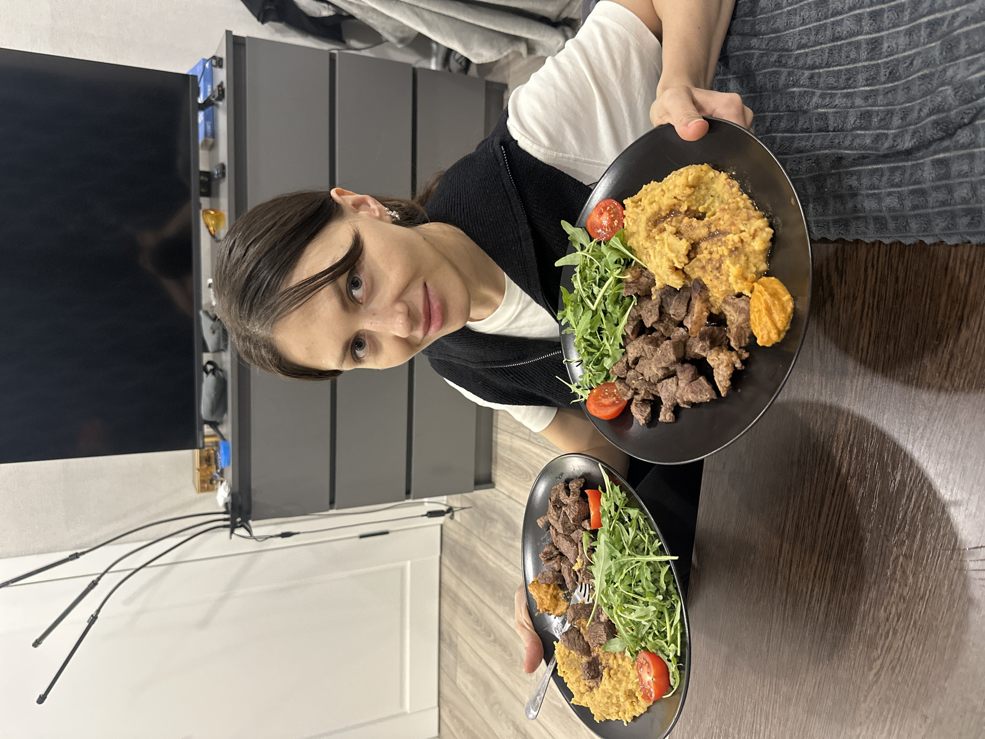 Woman enjoys meal in Murino, Russia