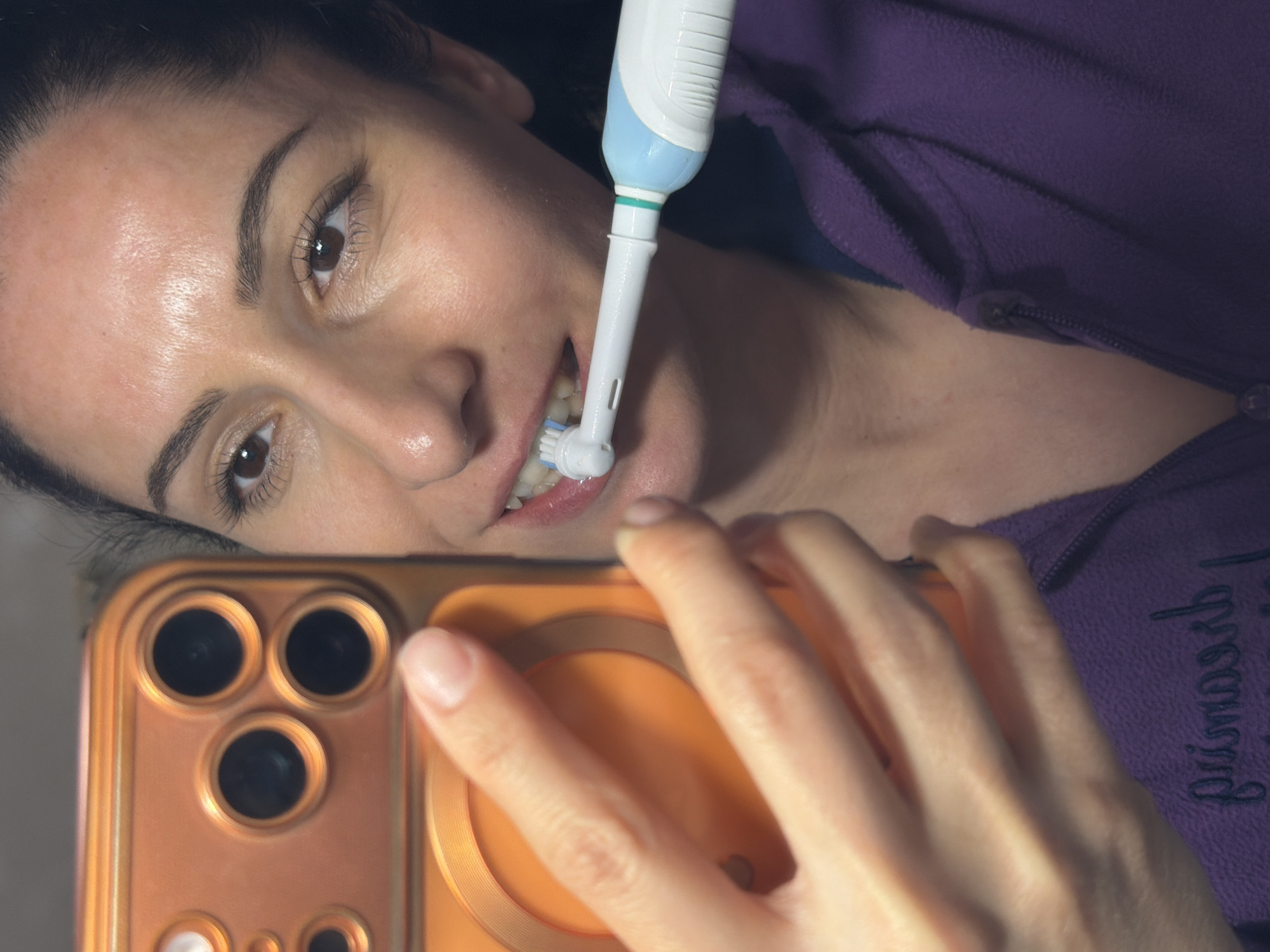 Woman takes selfie while brushing teeth in Pleven