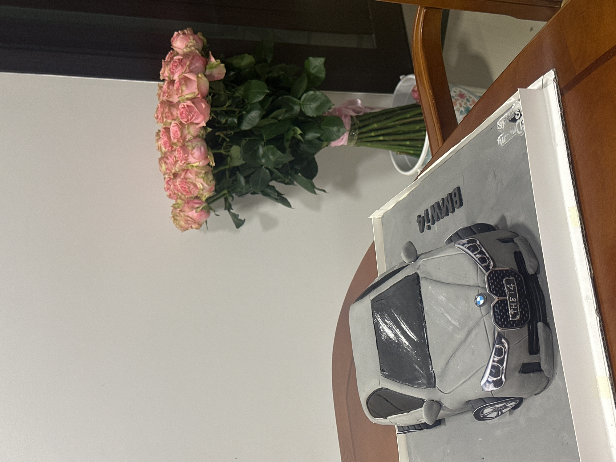 BMW car cake with pink roses photographed in Yerevan