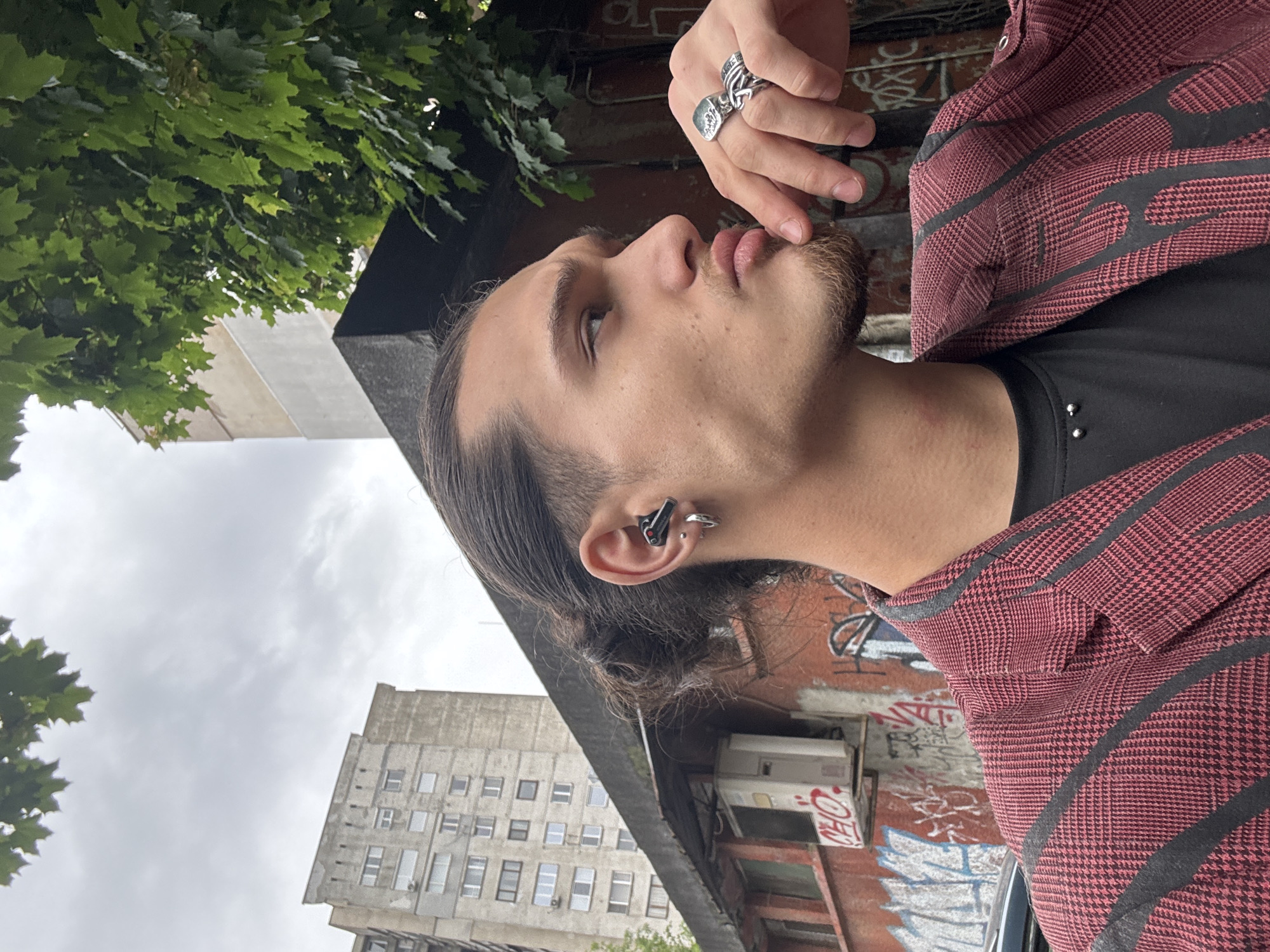 Young man in plaid blazer spotted on Sofia sidewalk