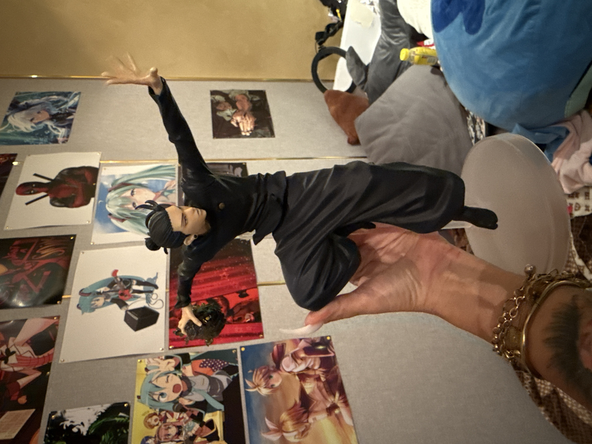 Anime figures, Funko Pops, and pet rats in an Odesa collector's room