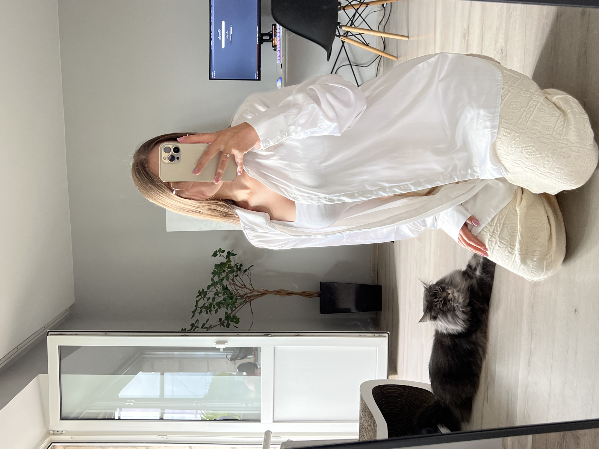 Mirror selfie session in a Ternopil apartment, cat included