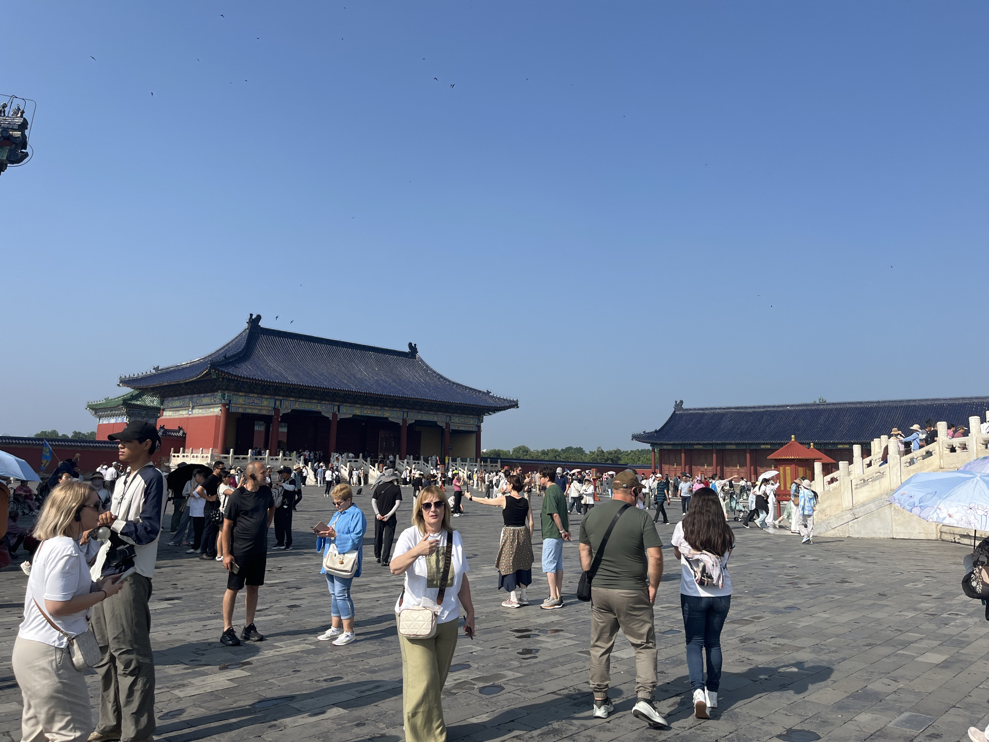 Crowds gather at Beijing's Temple of Heaven on a clear day
