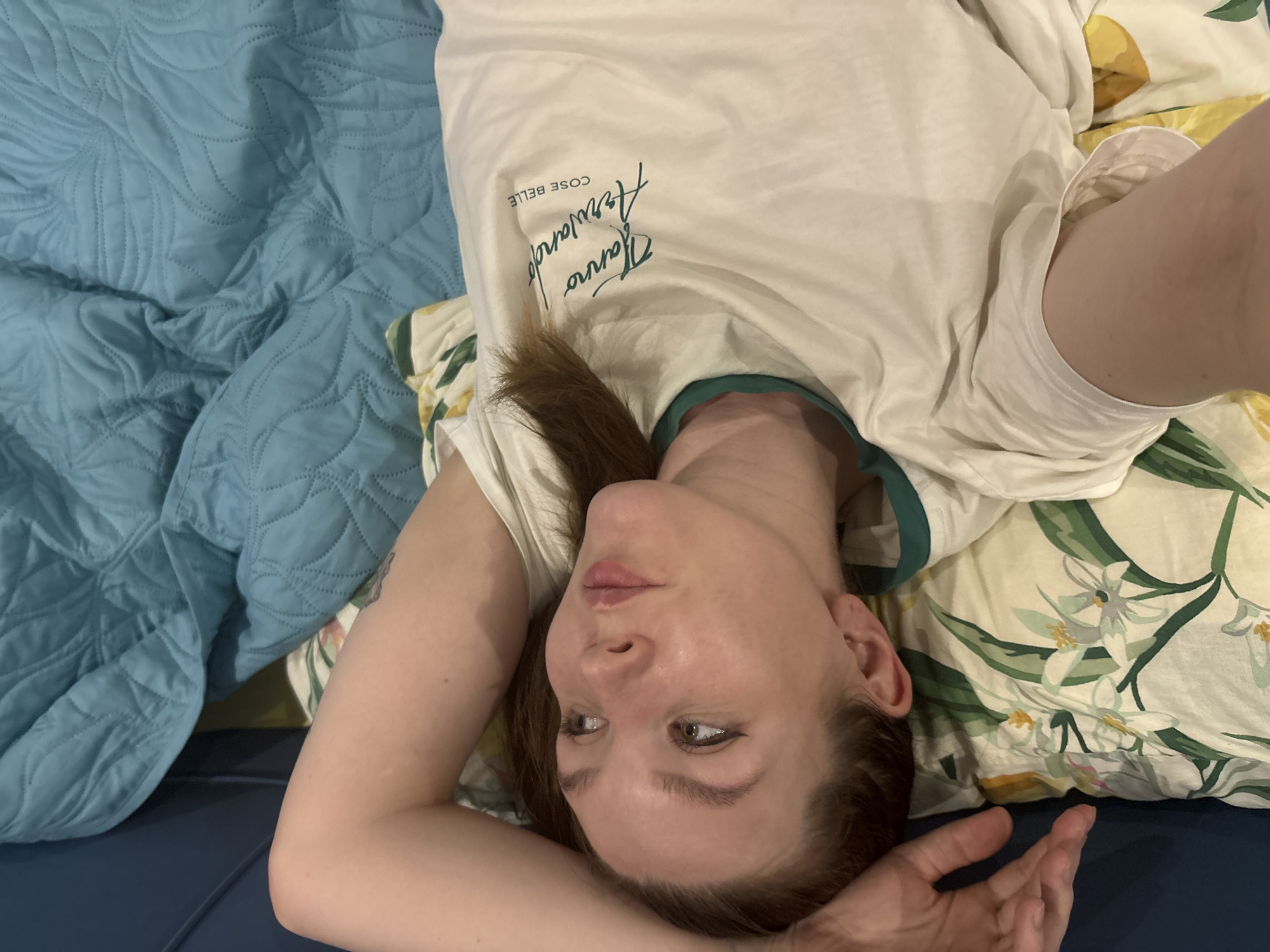 Woman and kitten share quiet domestic moments in Izhevsk bedroom