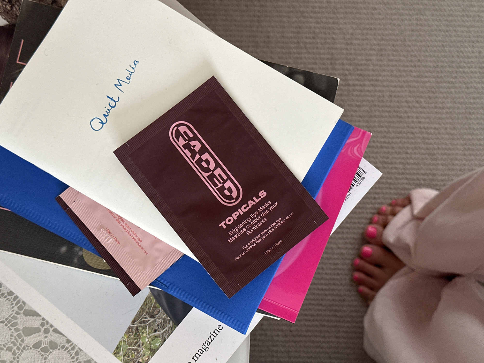 Handwritten 'Quiet Media' envelope photographed on book stack in Tunbridge Wells