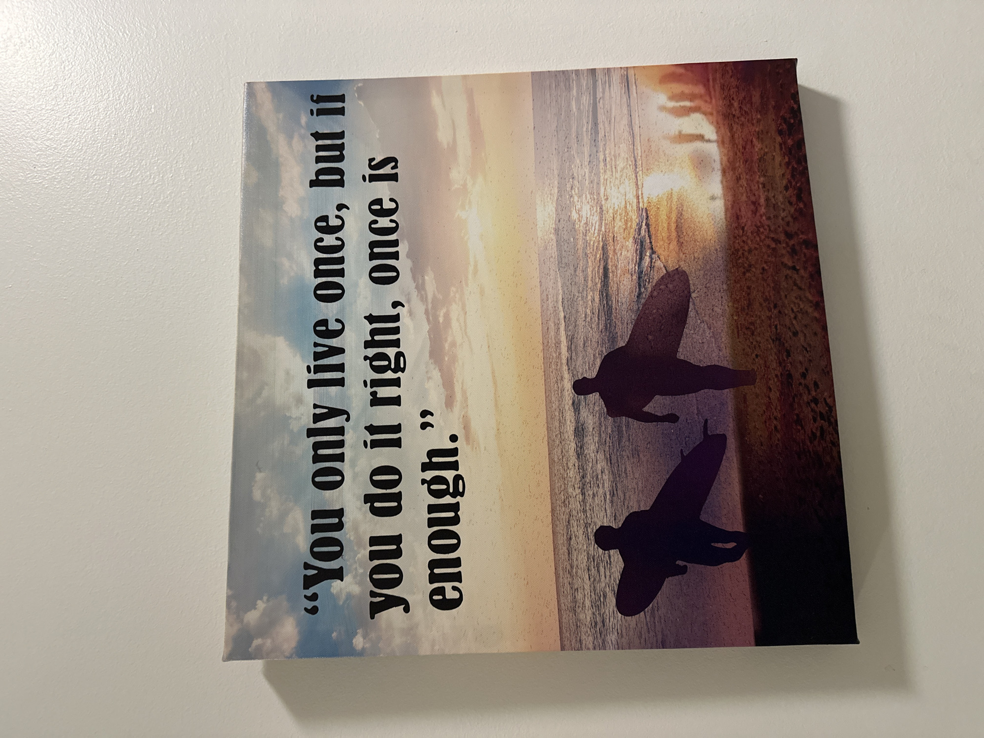 Beach-themed inspirational canvas art spotted on Sofia wall