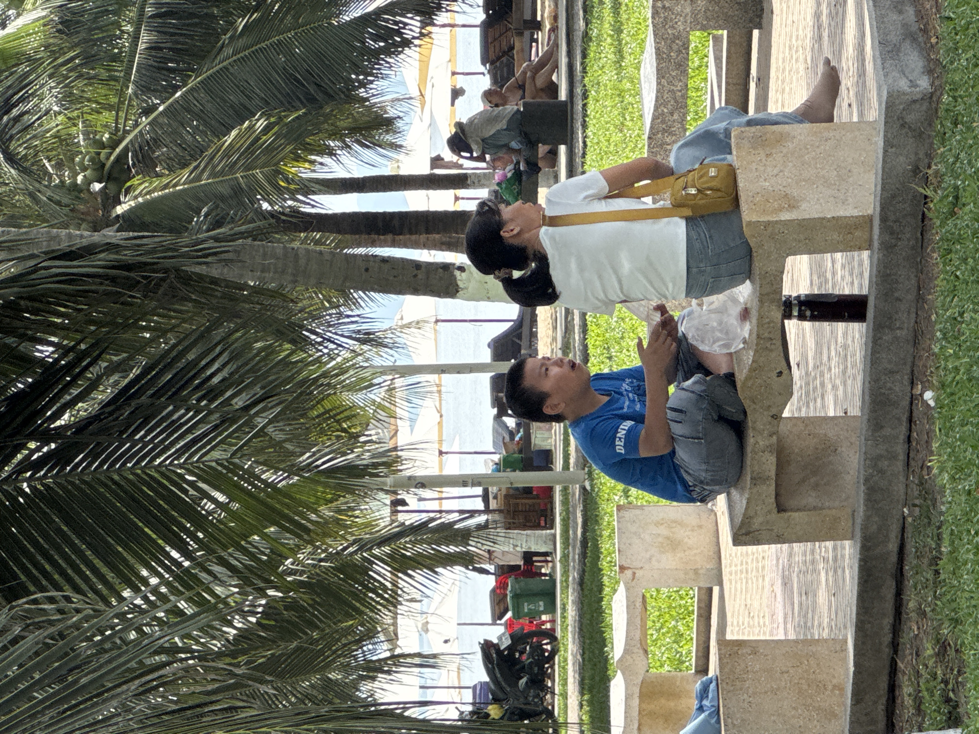 Beachside evening in Nha Trang — benches, stalls, and games
