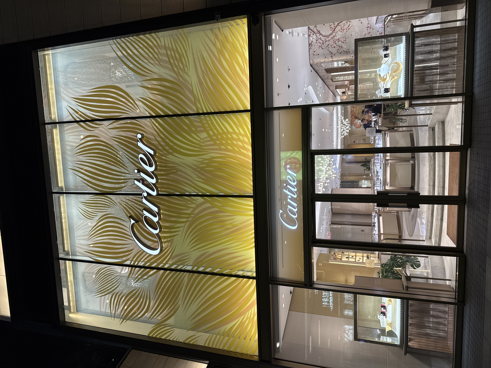 Luxury retail district bustling with shoppers and F1 display
