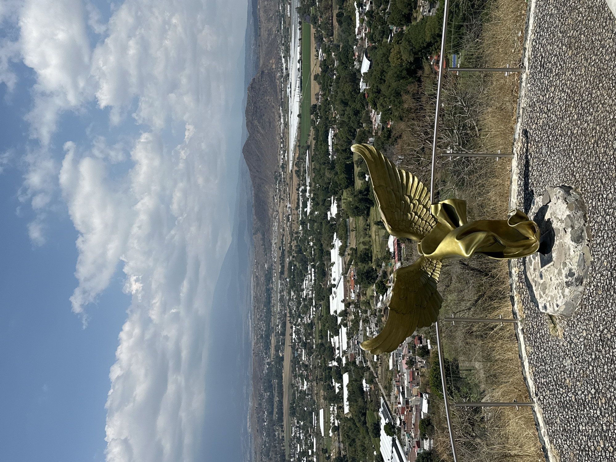 Golden eagle sculpture photographed atop Cerro de San Miguel, Atlixco