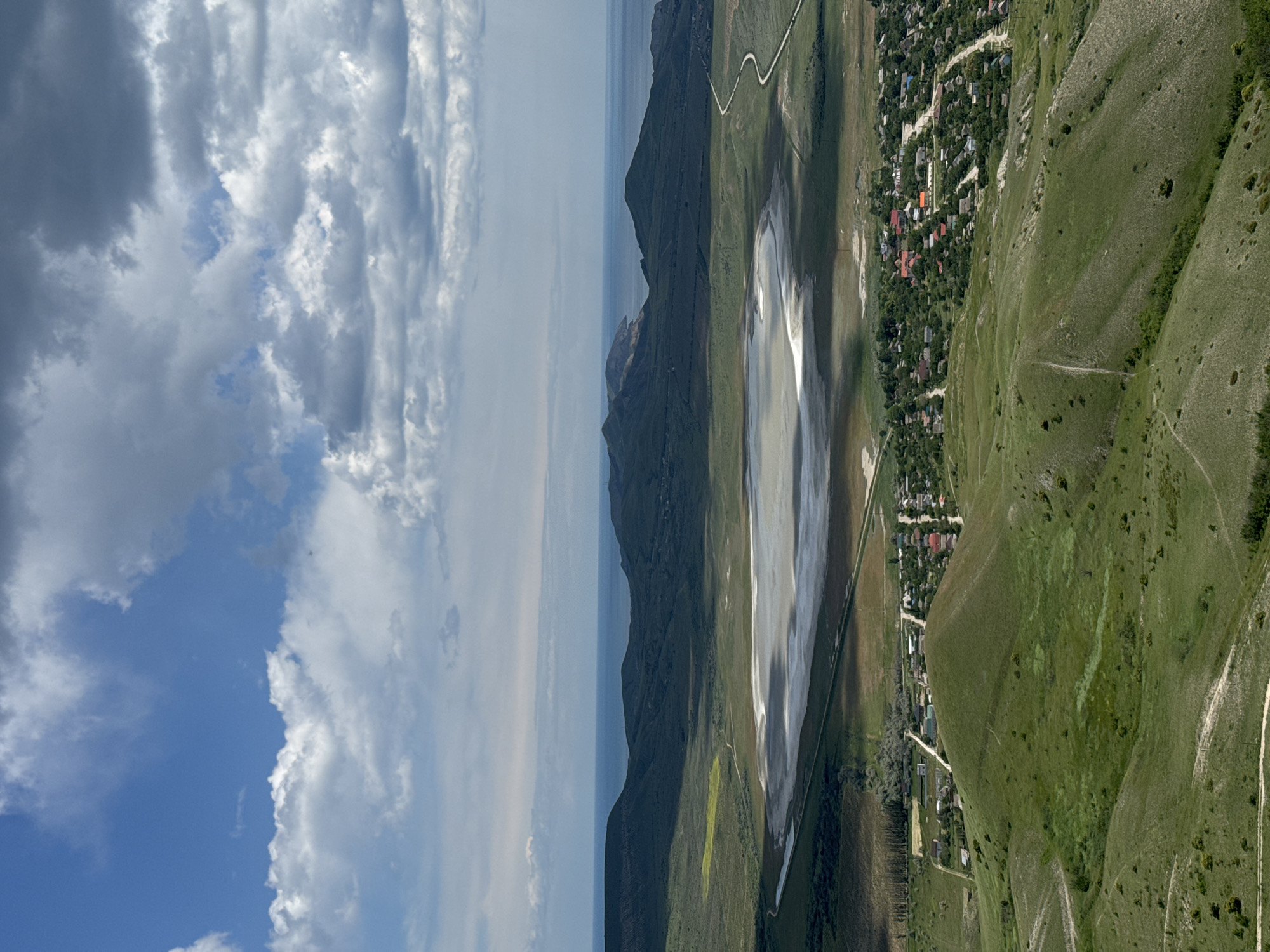 Aerial view captures Koktebel Ukraine mountains meeting cloudy sky
