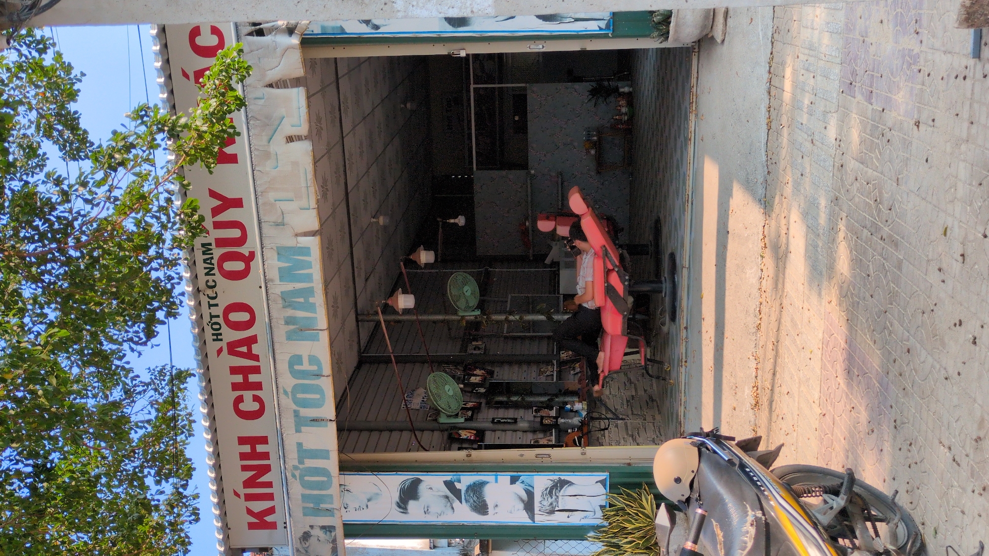 Barber shop serves customer in Phan Rang street scene