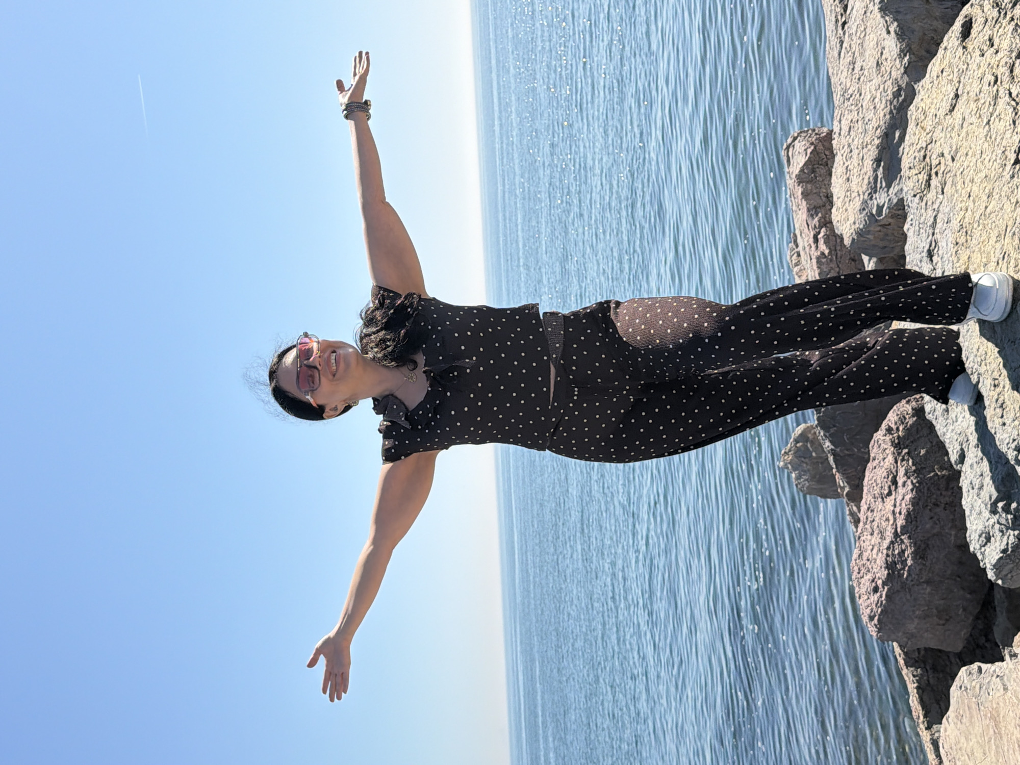 Woman poses on Kadıköy coastline during sunny afternoon outing