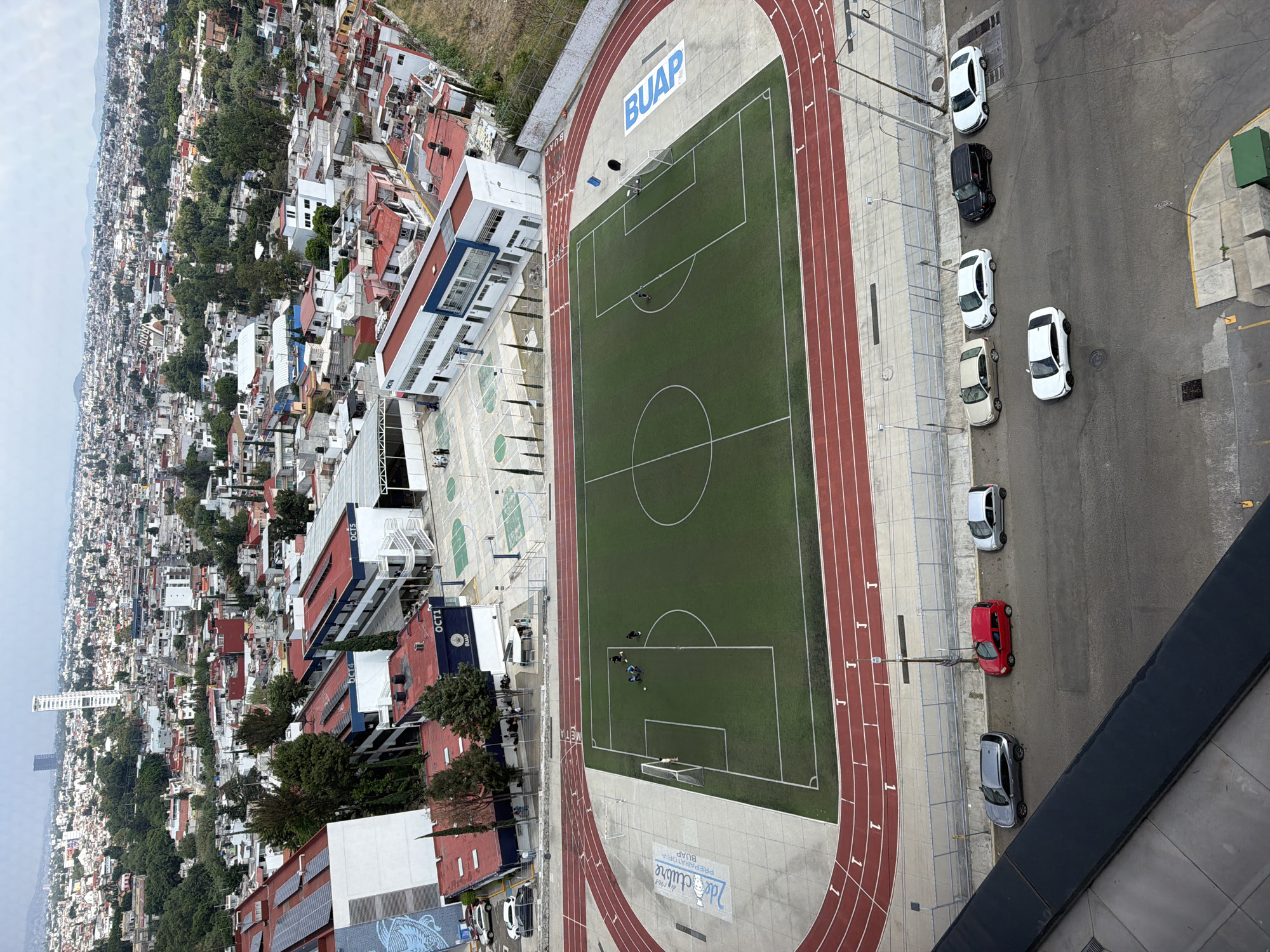 Aerial views document BUAP campus and surrounding neighborhood