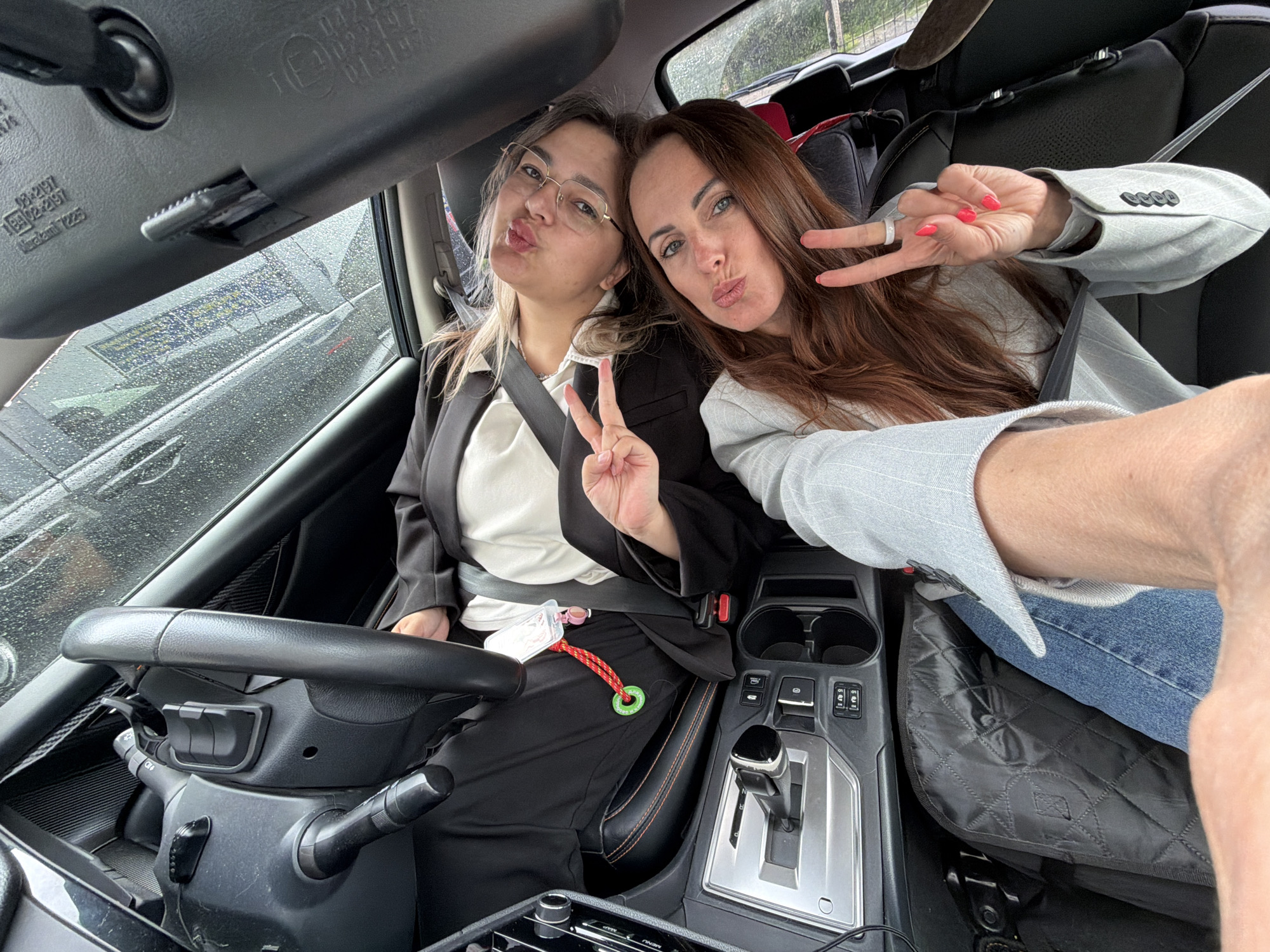 Two women take playful photos in Birobidzhan during early morning