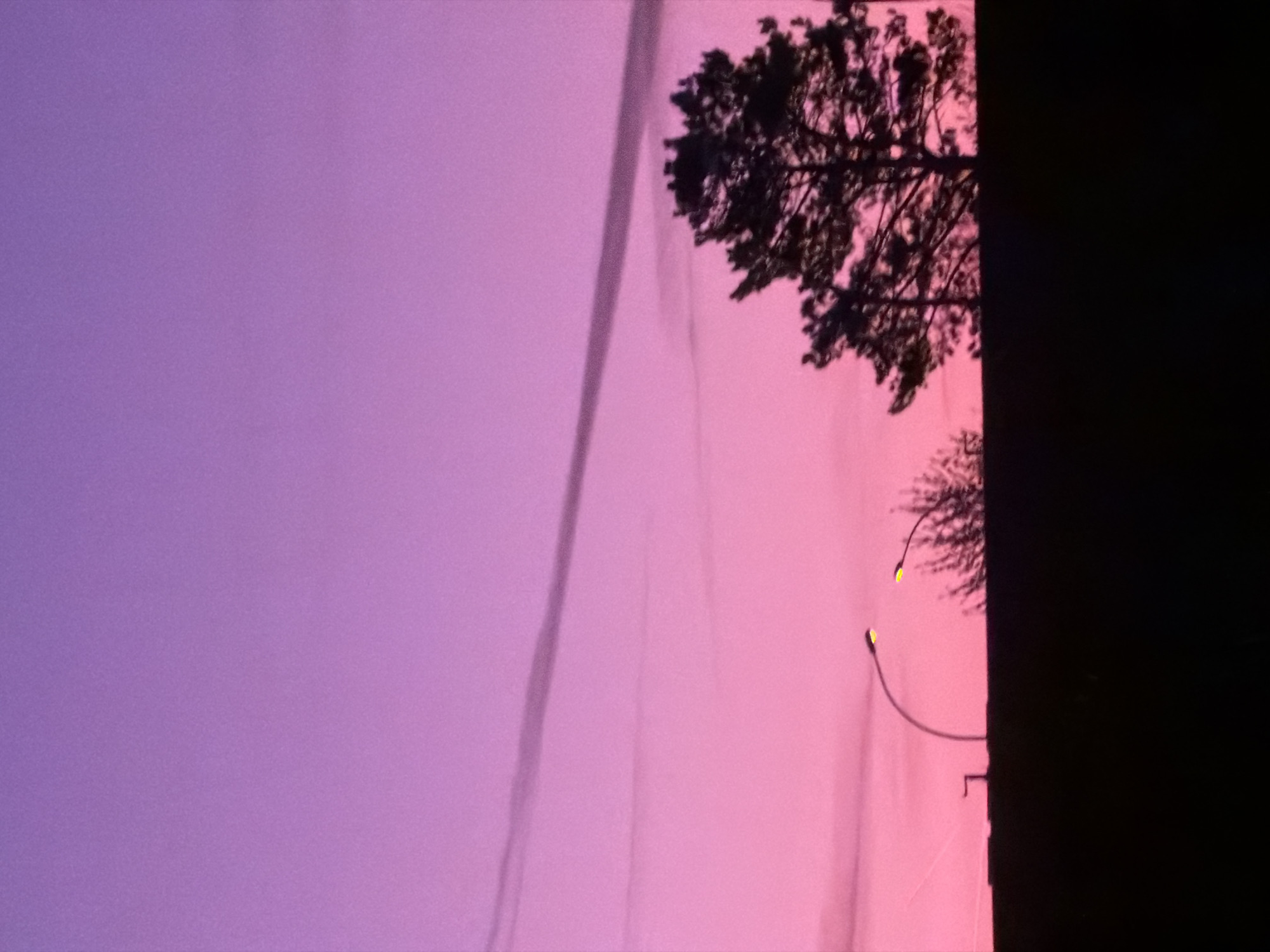 Purple-pink dawn sky observed over Leudelange, Luxembourg