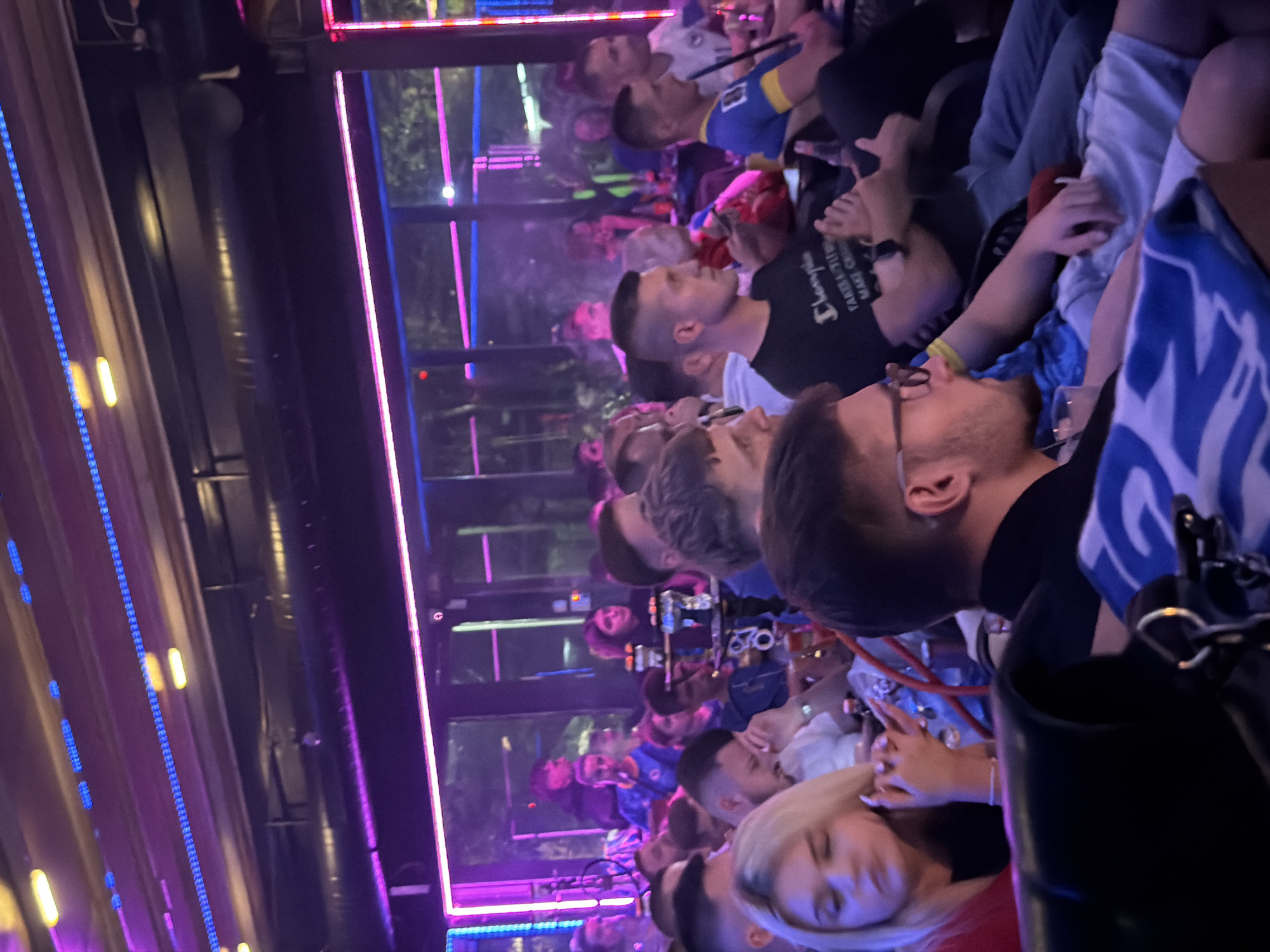 Watching football at a neon-lit bar in Travnik