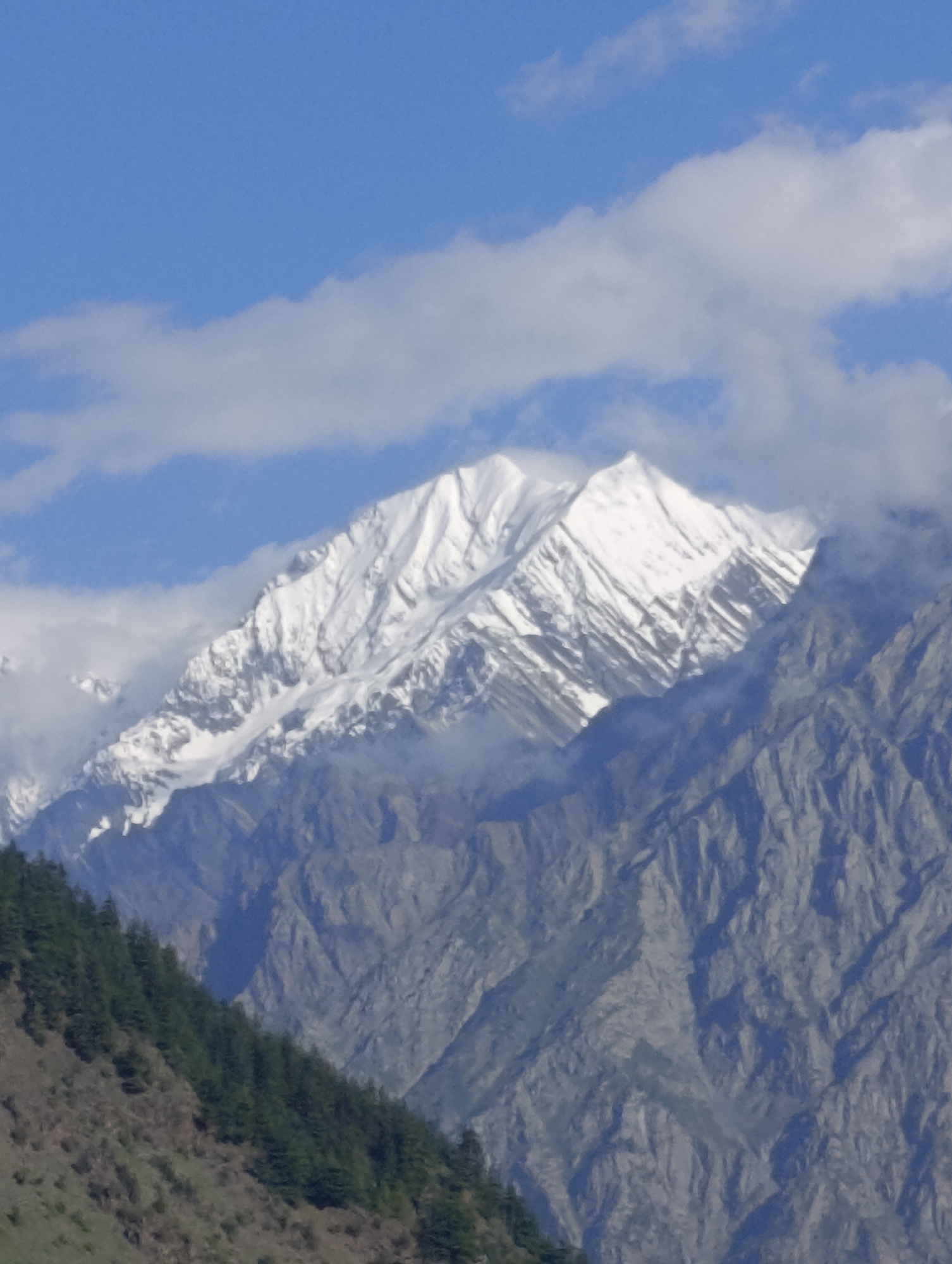 Snow peaks, river valley, ancient stupas, and active construction in Himalayan Udaipur