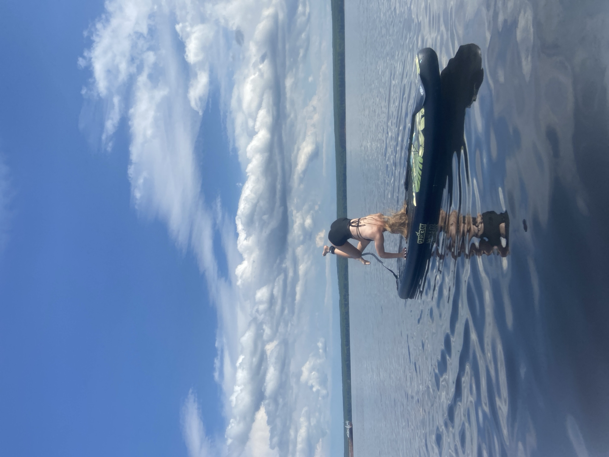 Paddleboard yoga and lake play near Chaikovsky, Russia