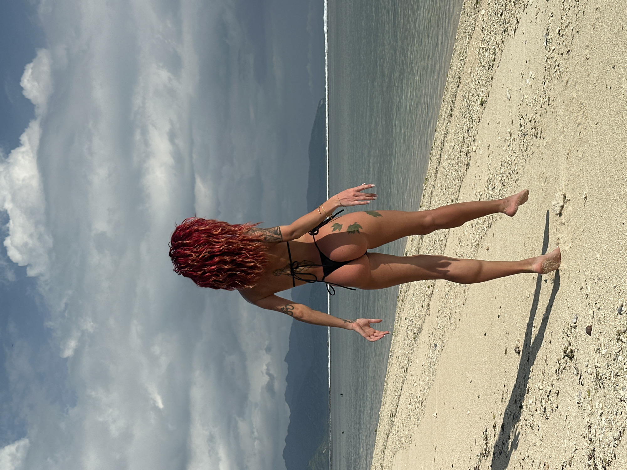 Woman with red hair spotted on Indonesian beach