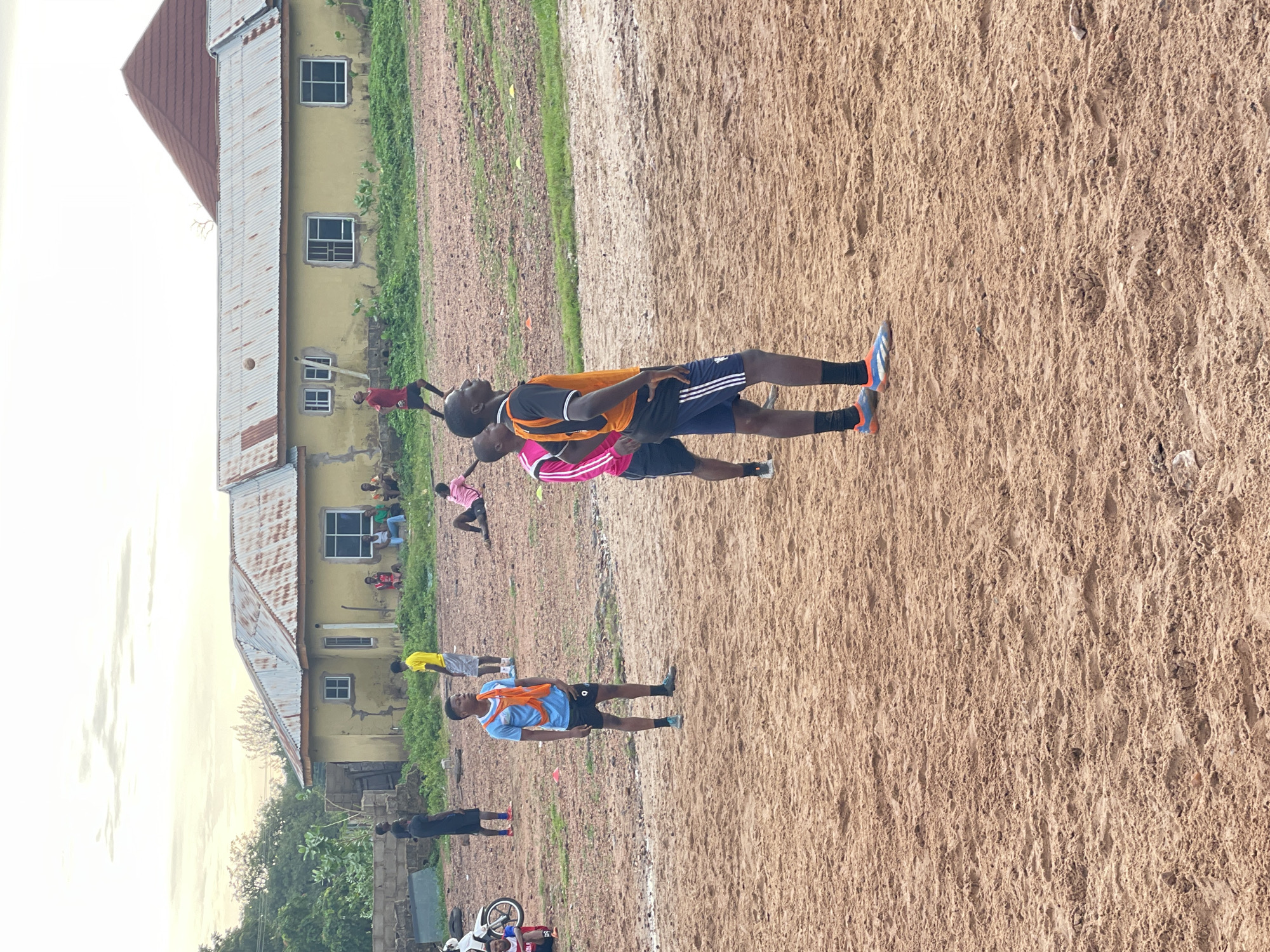 Pickup football on a dirt pitch in Lokoja, Nigeria