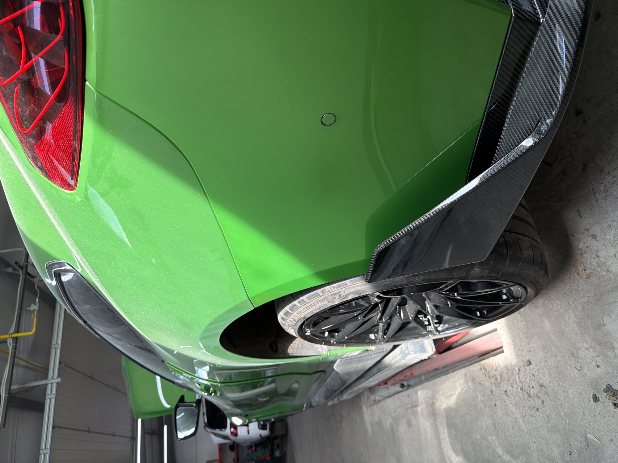Collision-damaged green car undergoes major repairs in Burgas shop
