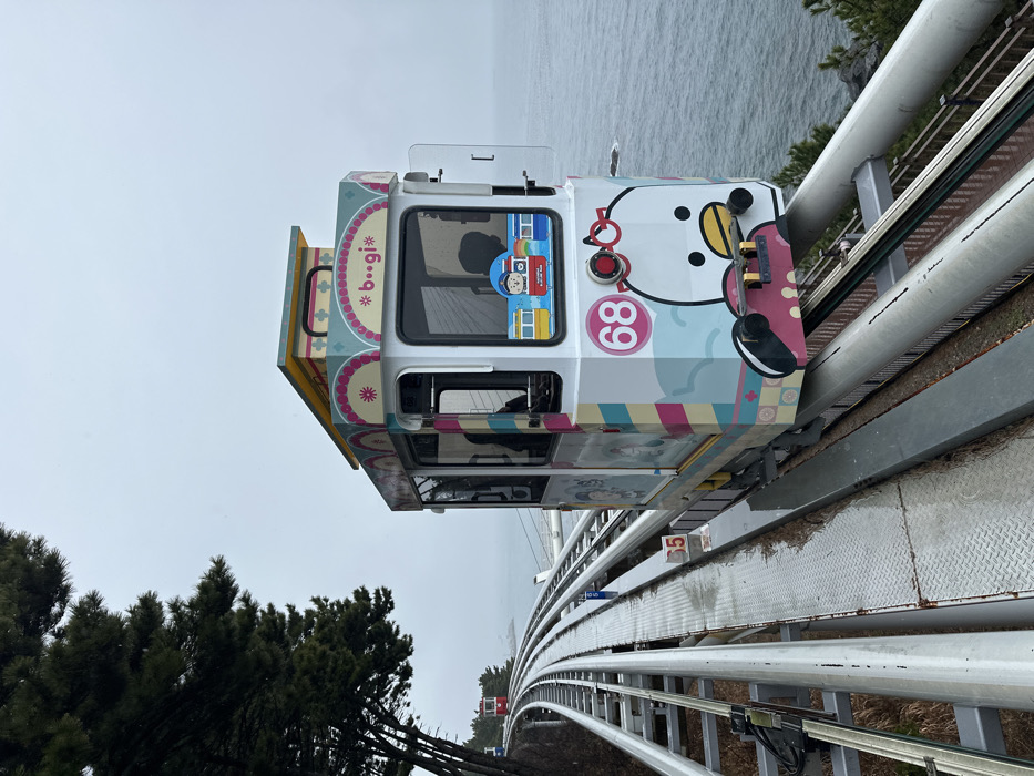 Monorail cars spotted on wet coastal tracks in Busan