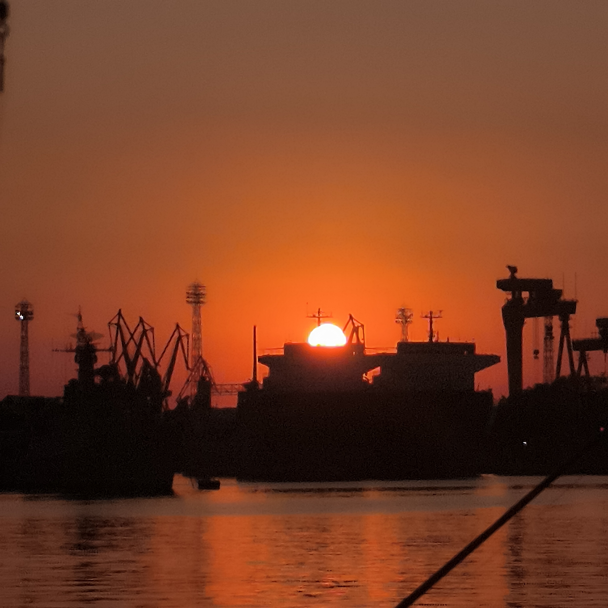 Sunset over Varna Port, ships, sailboats, and fresh catch