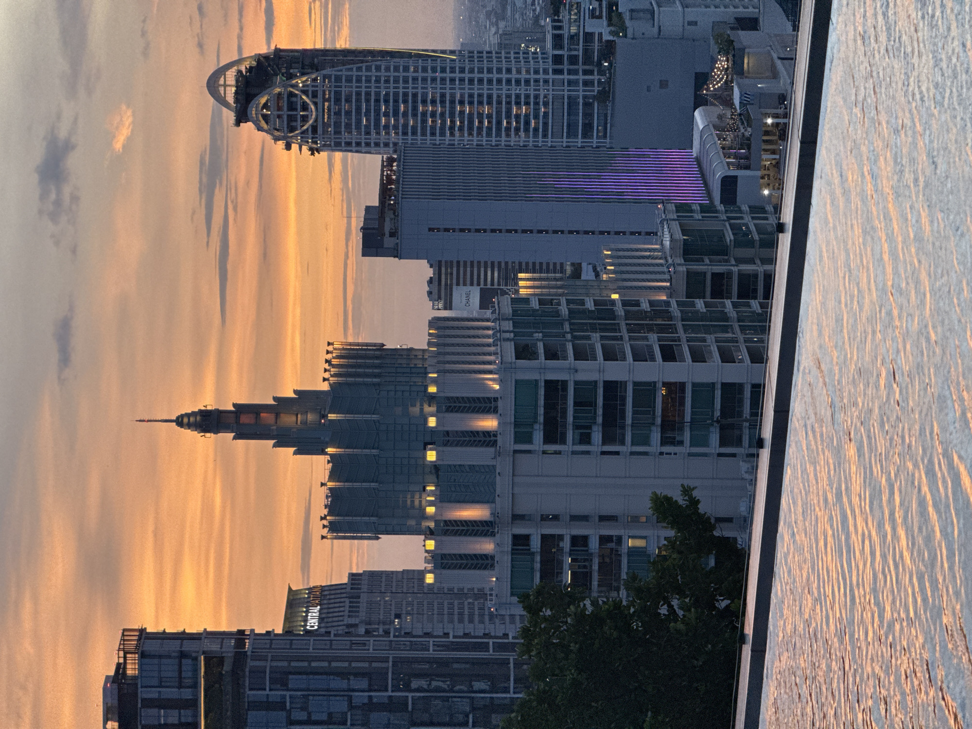 Bangkok rooftop infinity pool at dusk, skyline views