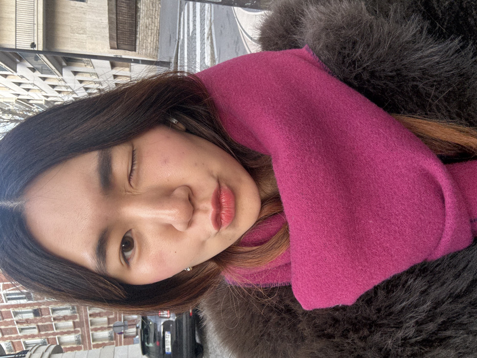 Woman Takes Selfies on Paris Street