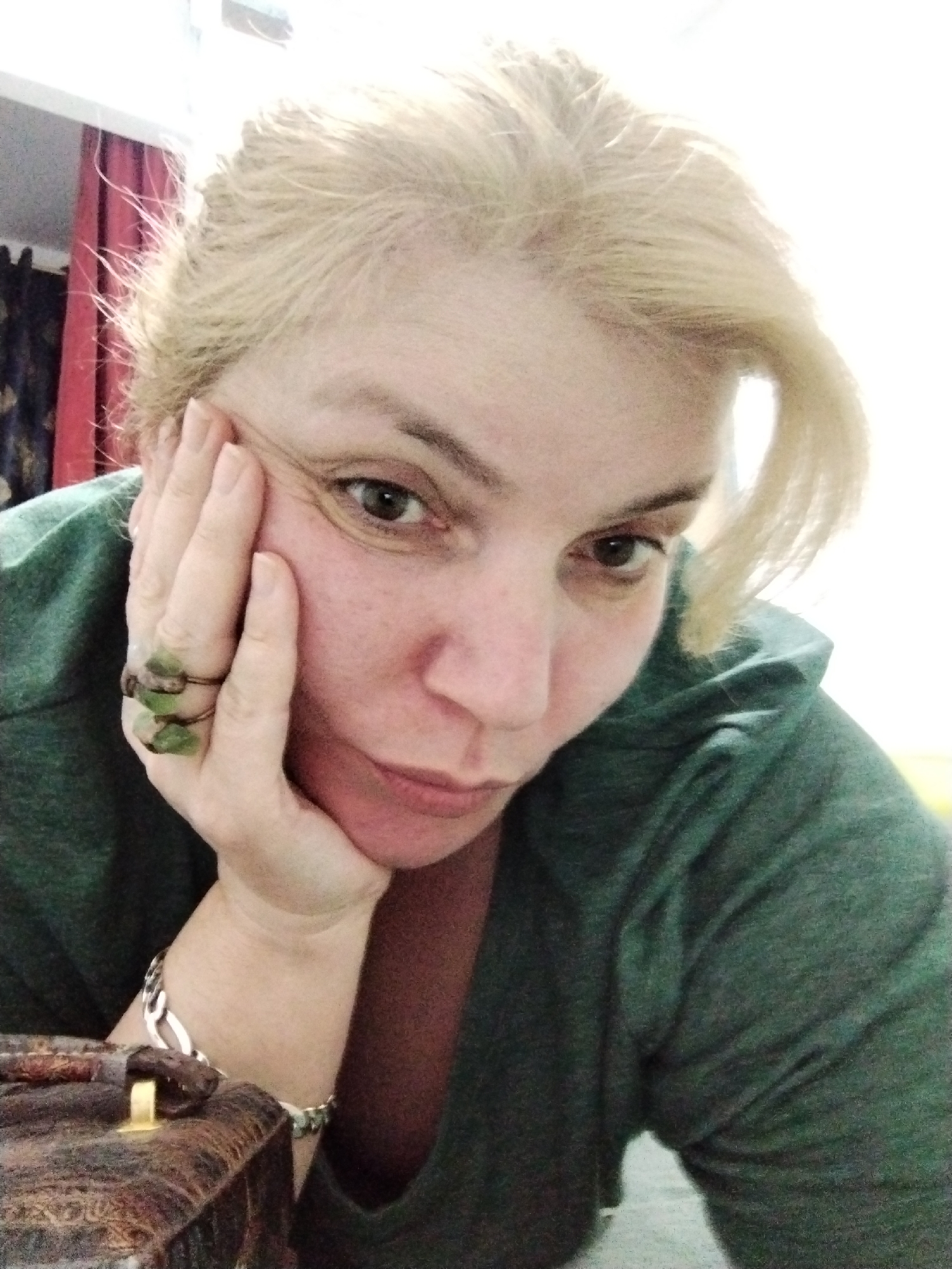 Woman displays handmade turquoise jewelry in UAE