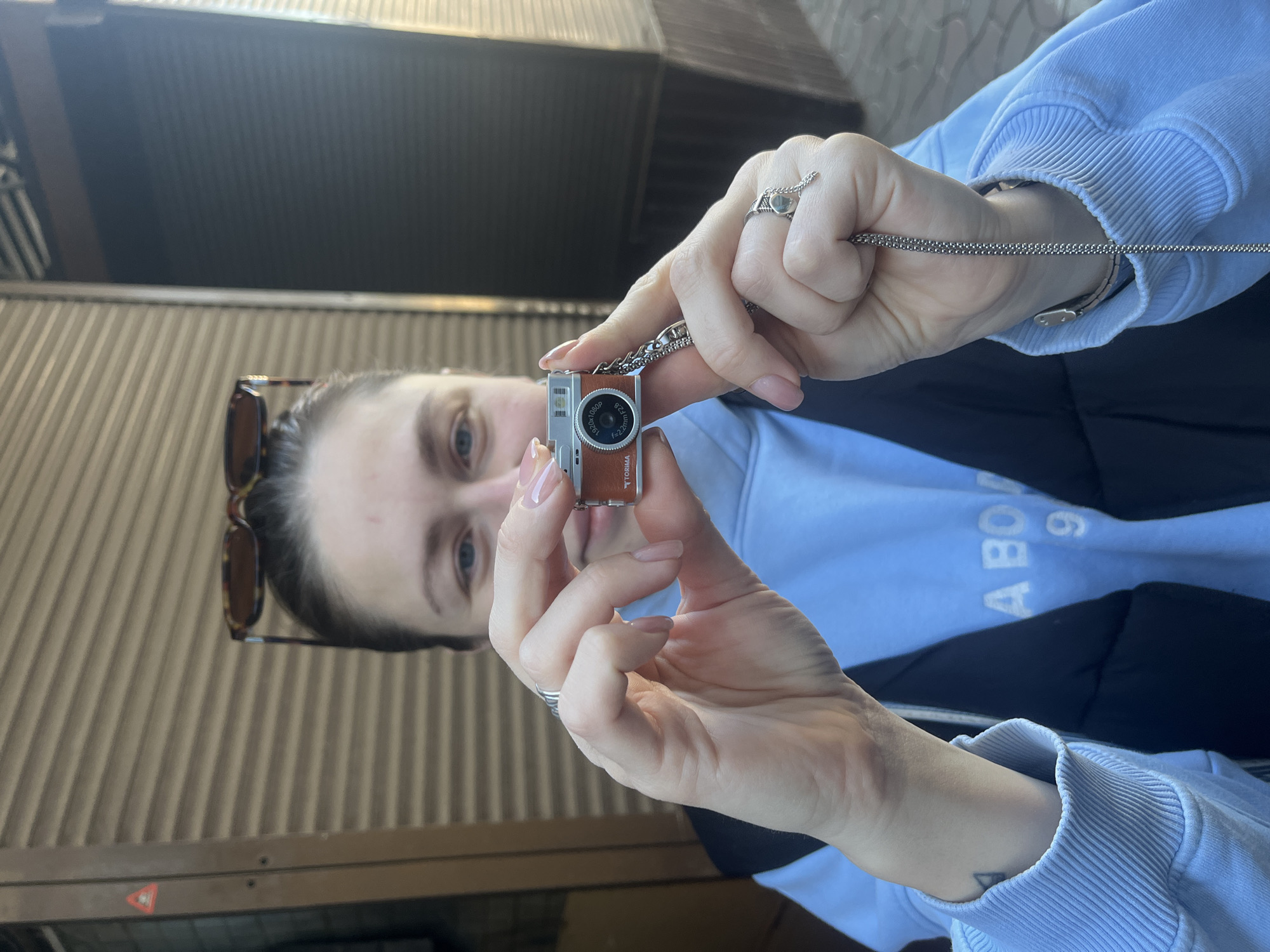 Woman documents pet store animals with camera necklace in Odesa