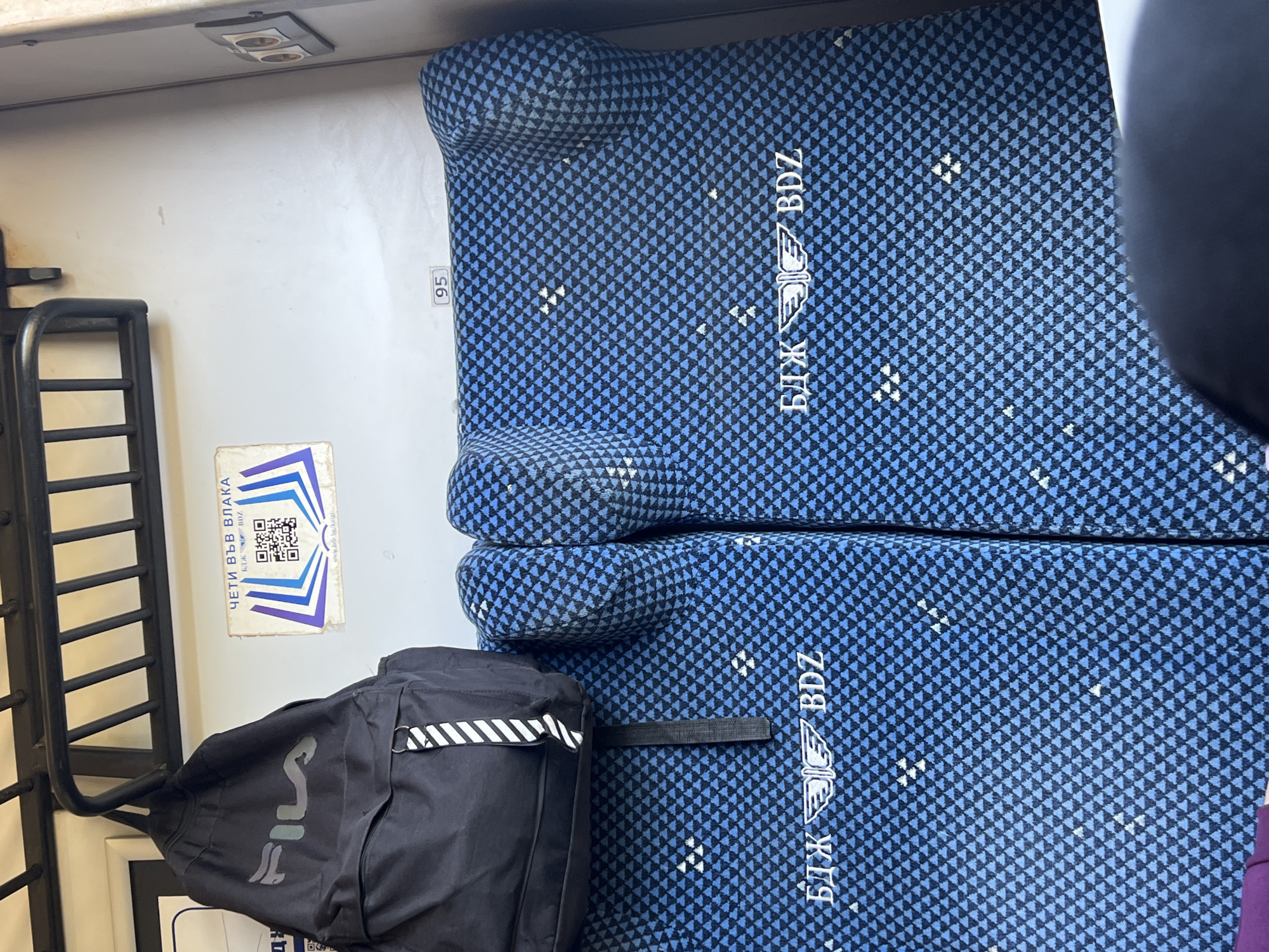 Train passenger documents journey through Bulgarian countryside near Mezdra