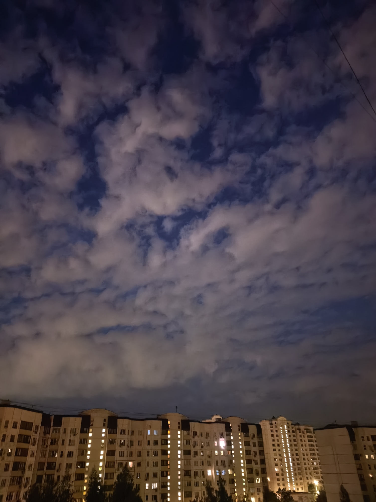 Late-night Moscow apartment towers, courtyards, and indoor snapshots