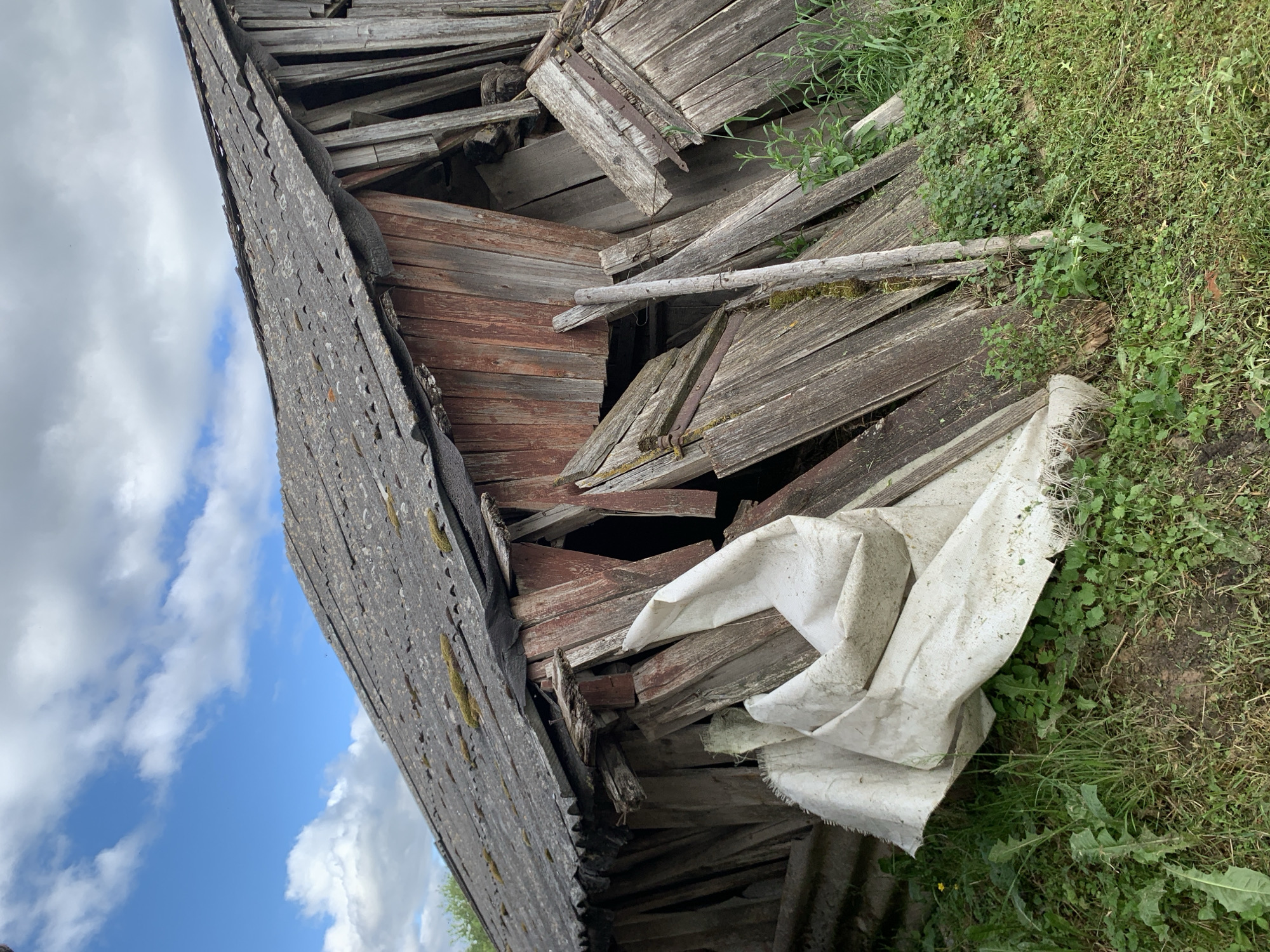 Rural Belarus village life documented through weathered structures, gardens