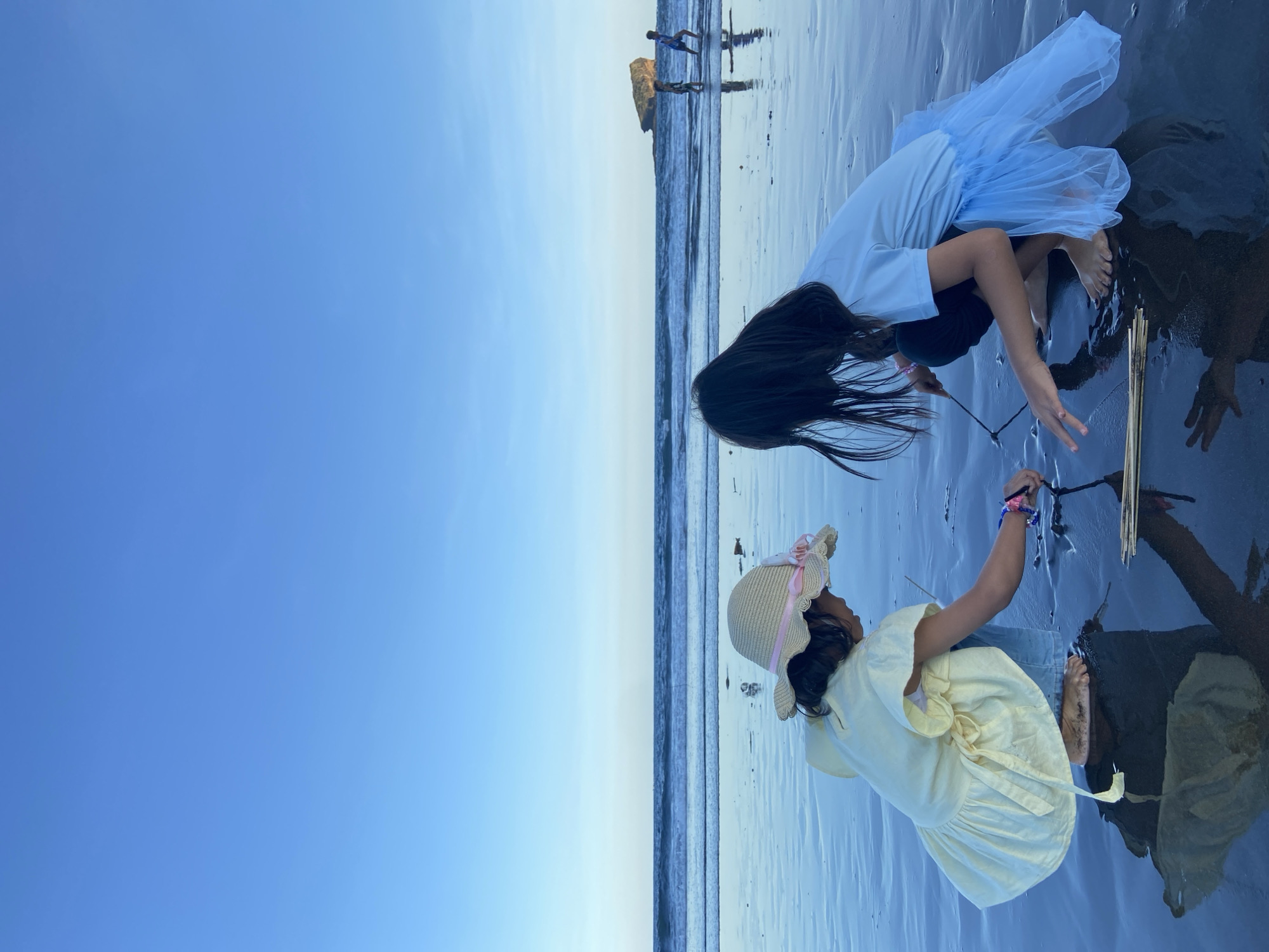 Families enjoy morning beach outing at Indonesian coastal location