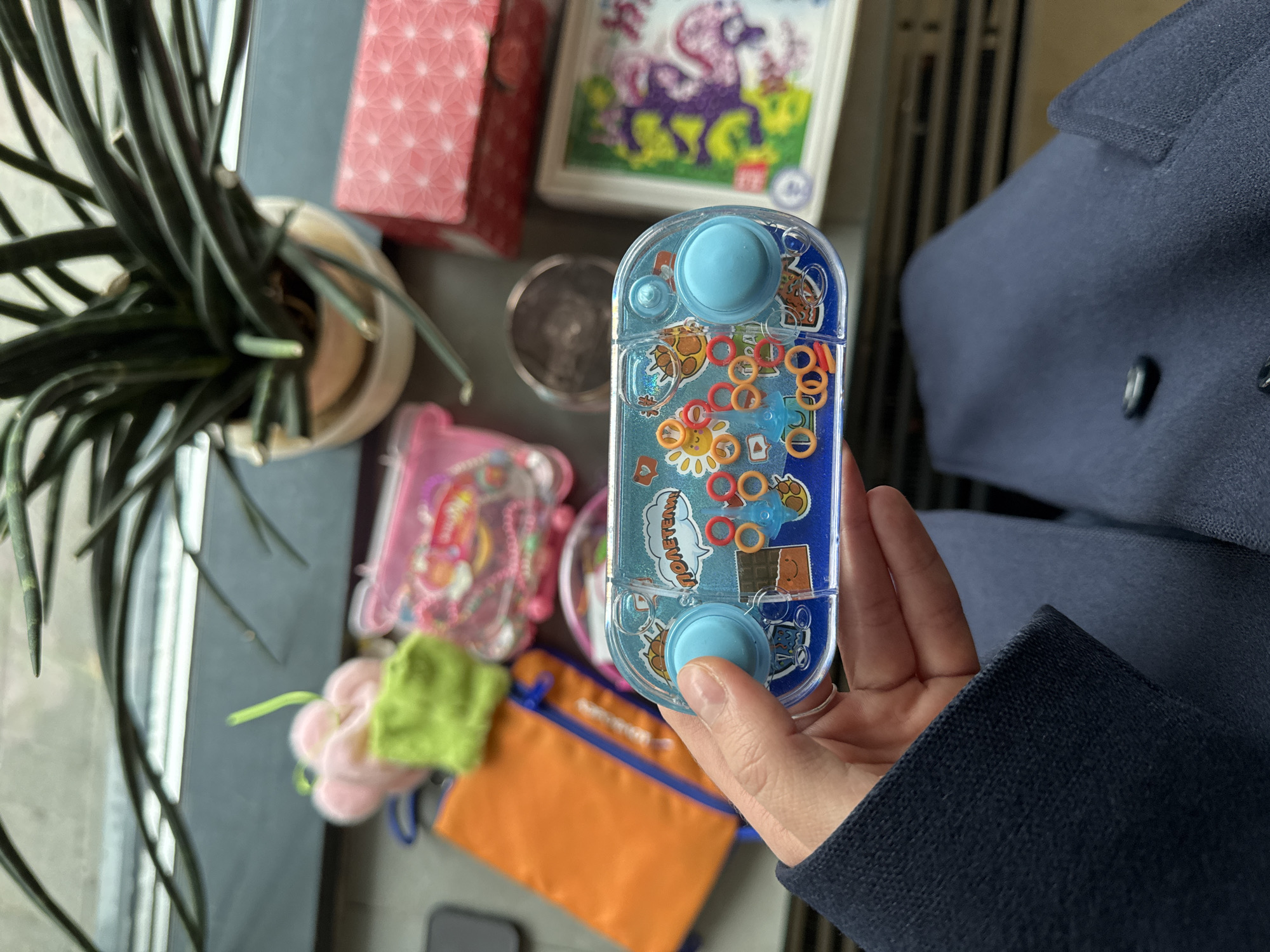 Person holds vintage water ring game in Moscow