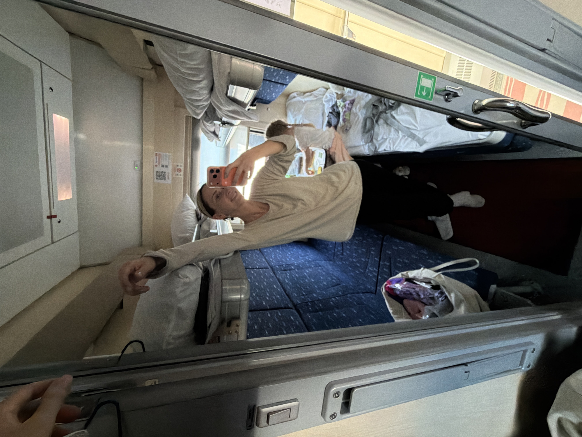 Woman takes selfie in train compartment near Saratov Station
