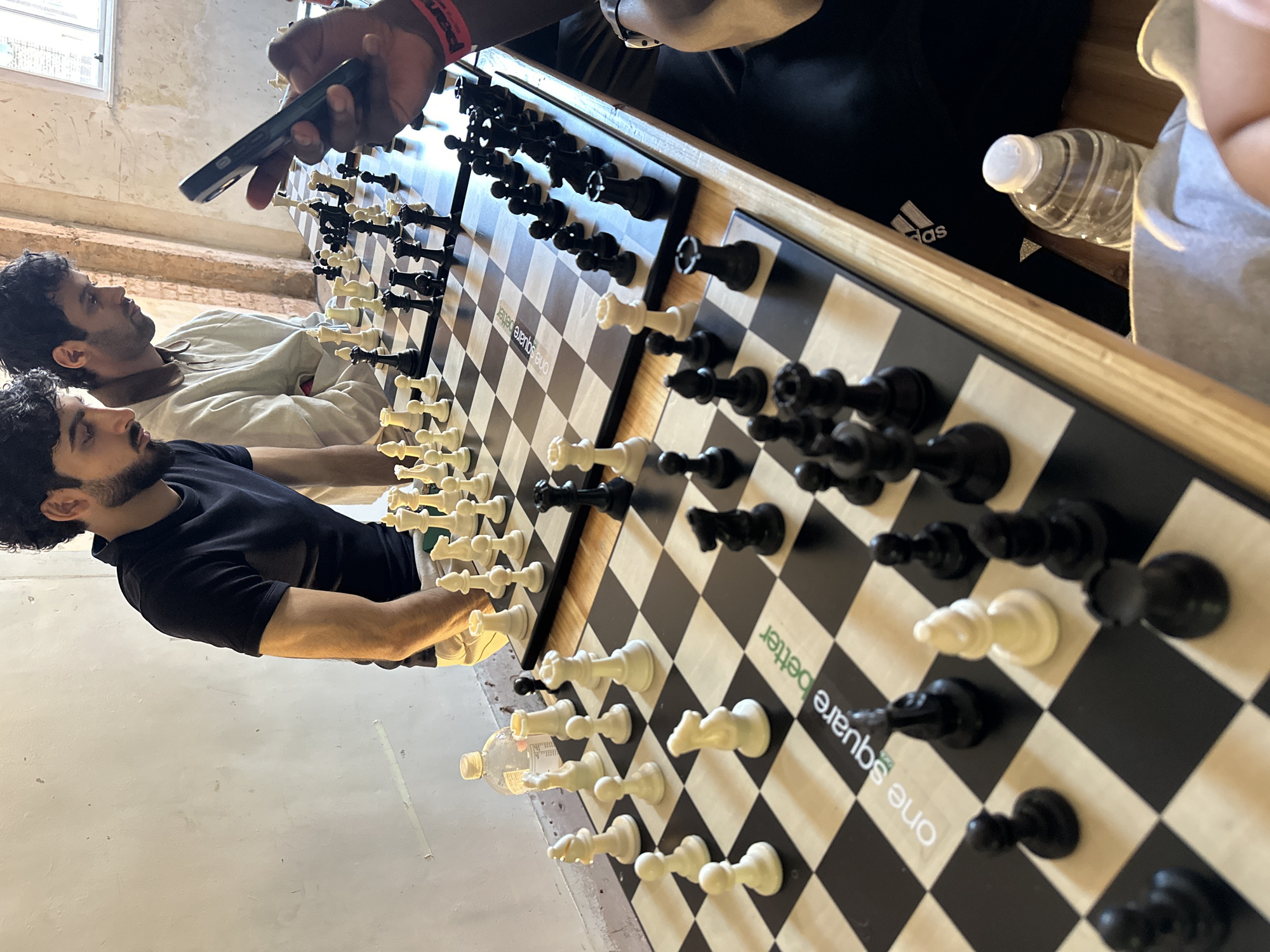 Two men play chess on large board in London