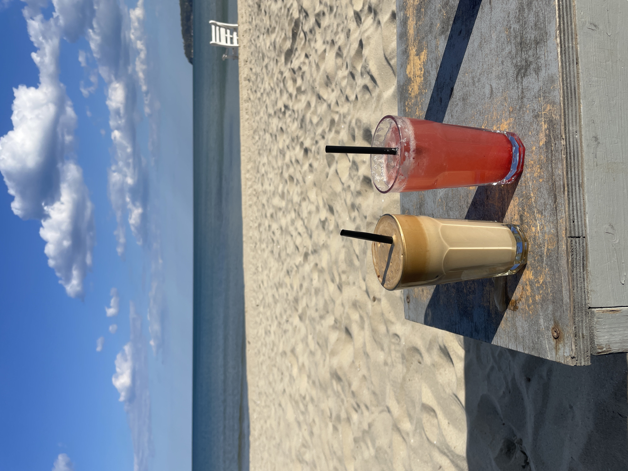 Beachside drinks captured on wooden table in Varna