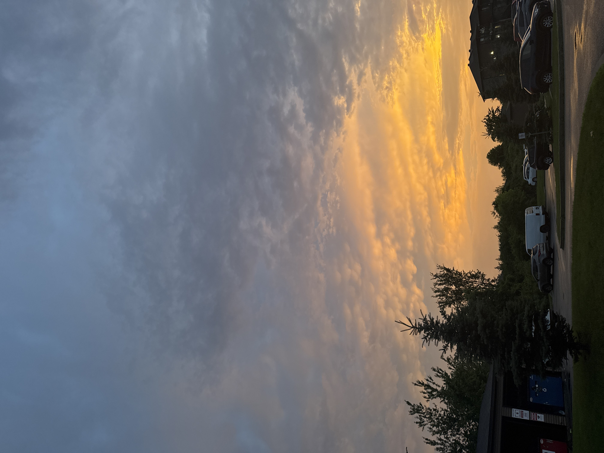 Striking summer sunset over a Gatineau parking lot