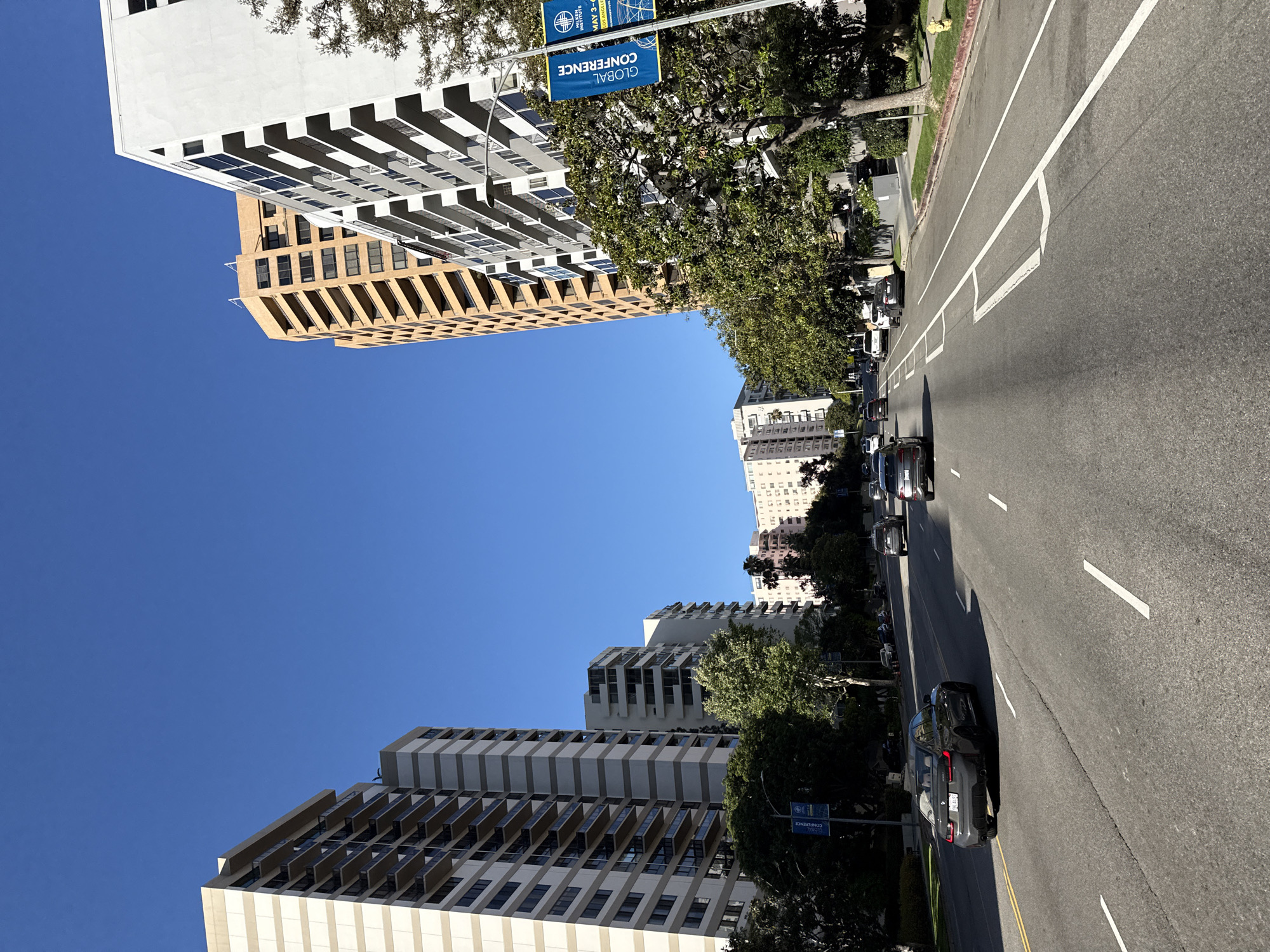 Clear night captures modern high-rises lining Los Angeles street