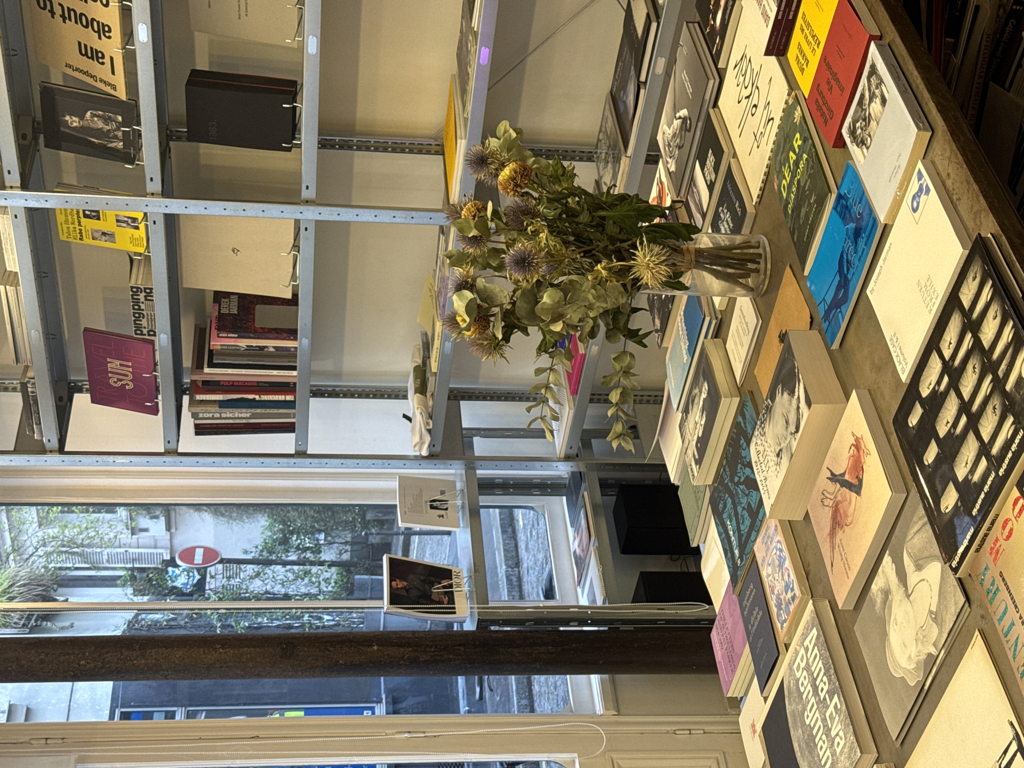 Paris bookstore interior captured with books and dried flowers