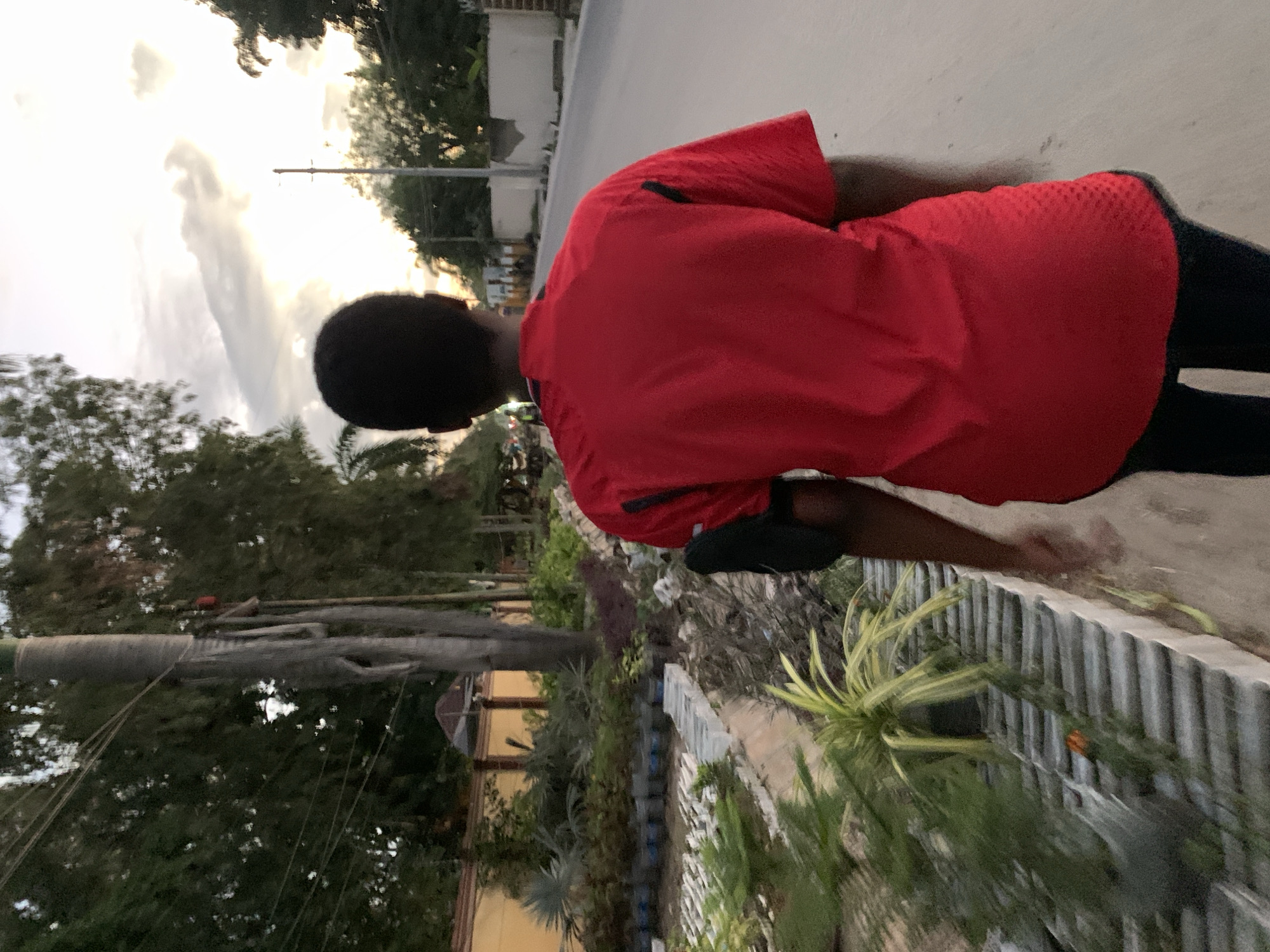 Afternoon to dusk in Dar es Salaam — streets, soccer, and city lights