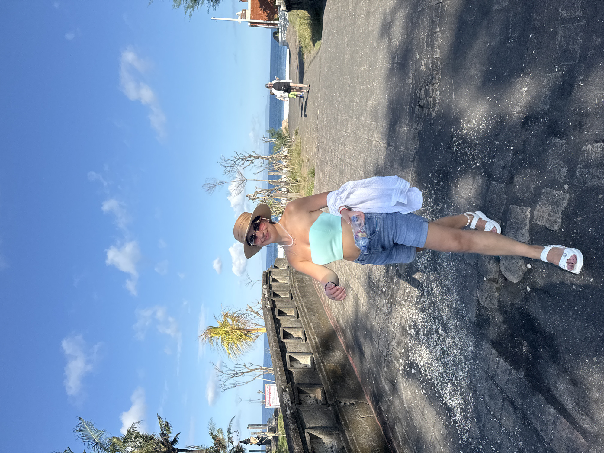 Morning beach activity captured at Blahbatuh's black sand shores
