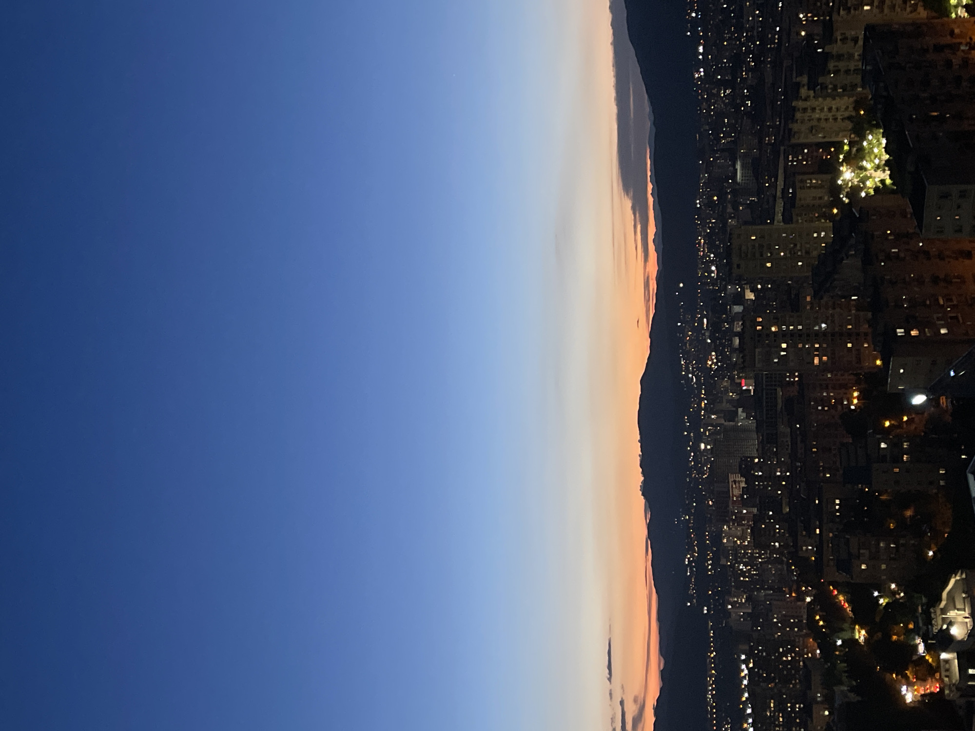 Twilight cityscape views across Tbilisi from elevated balcony