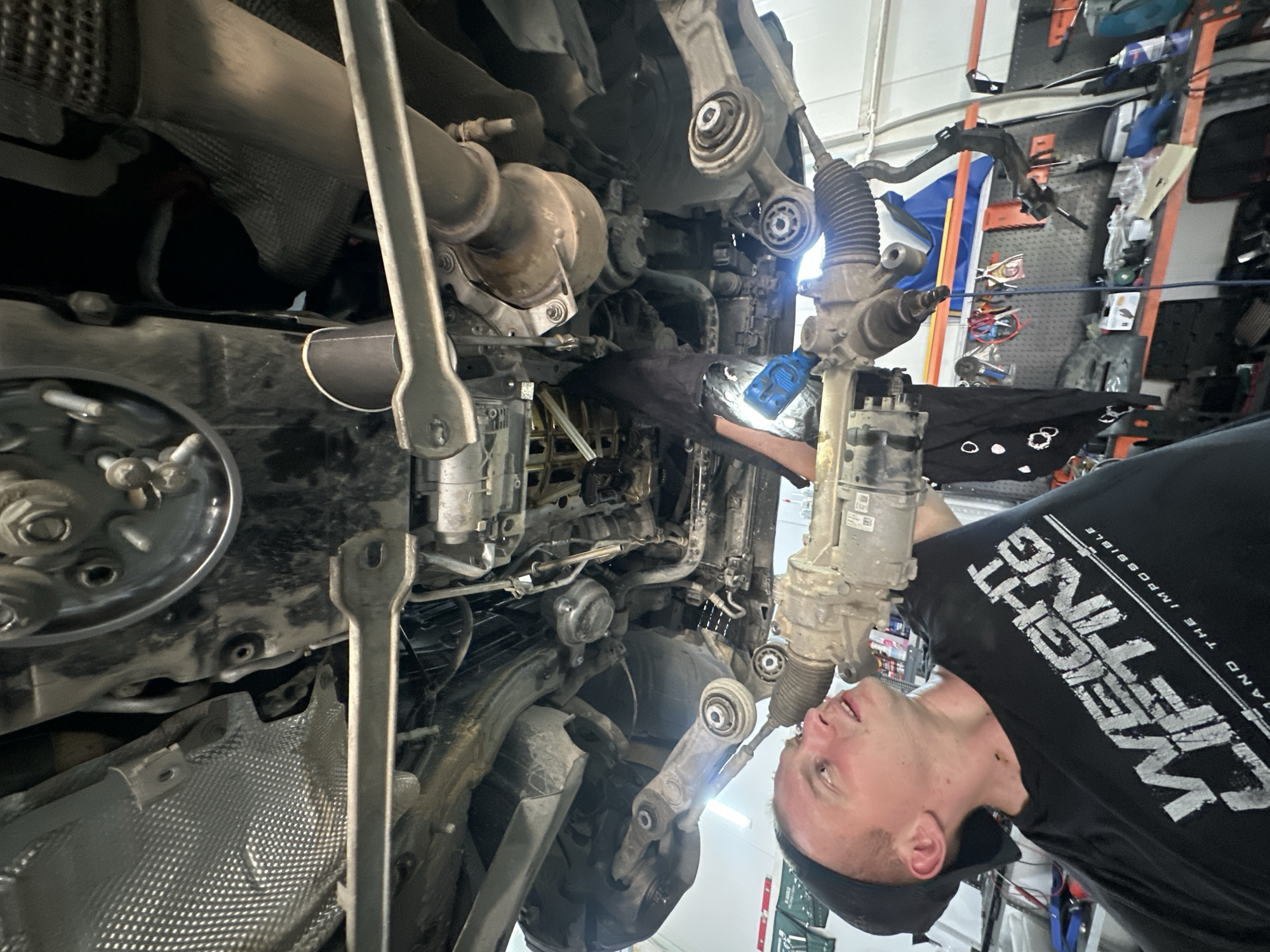 Mechanic services Mercedes while grilling lunch in Blagoveshchensk garage