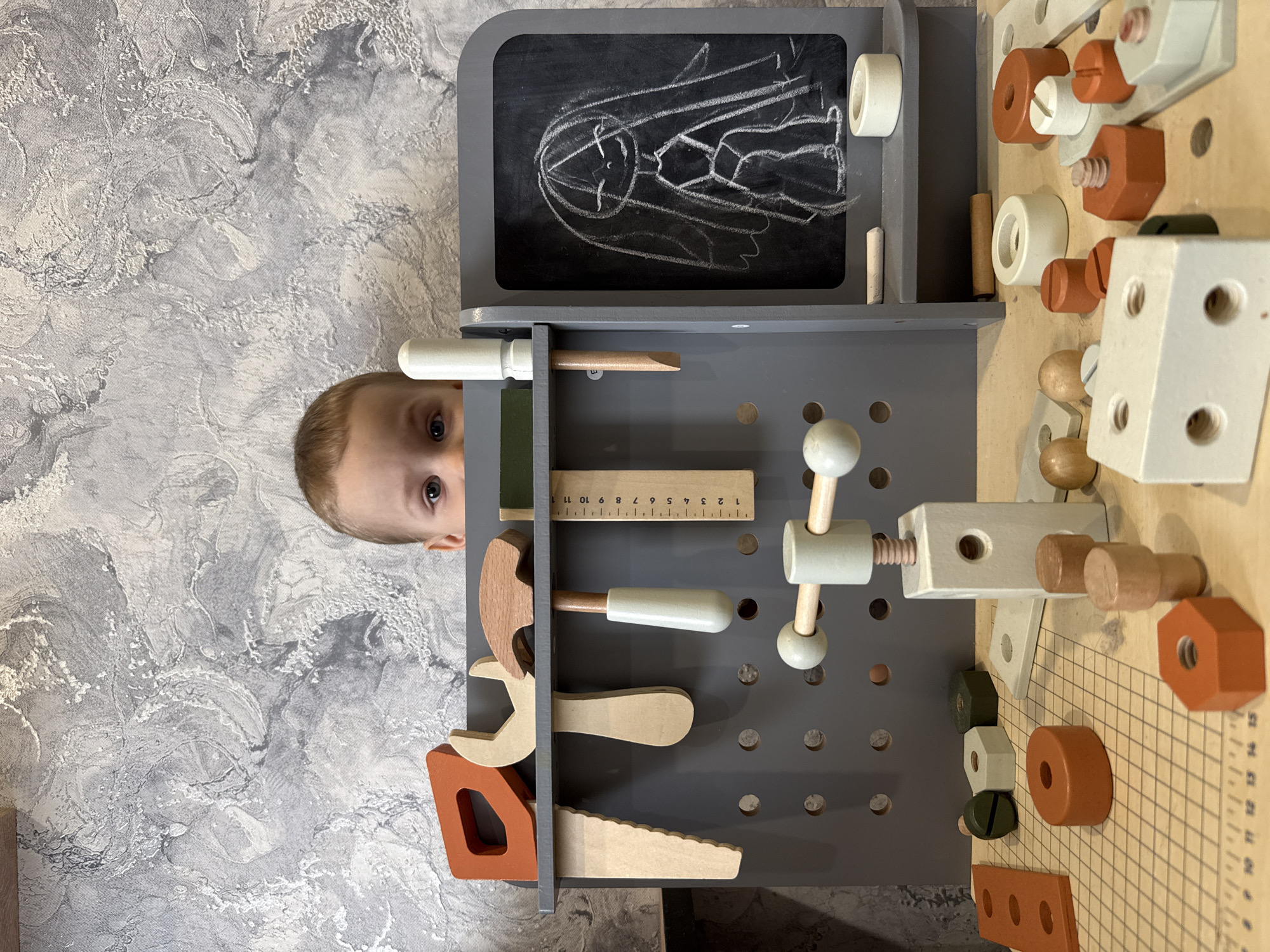 Child plays with bubbles and toys in Rusanovo home