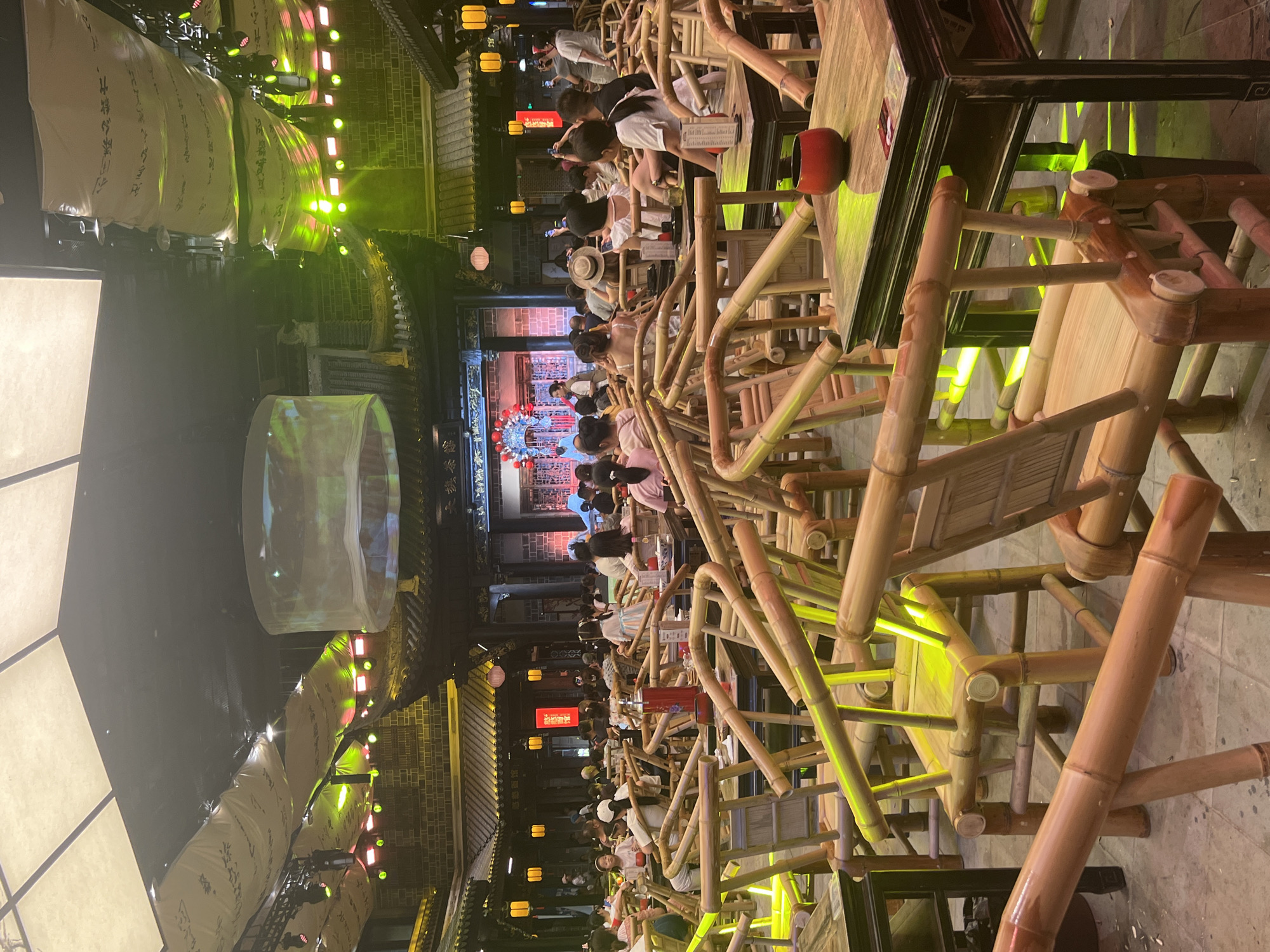 Bamboo-furnished indoor venue staged for live performance