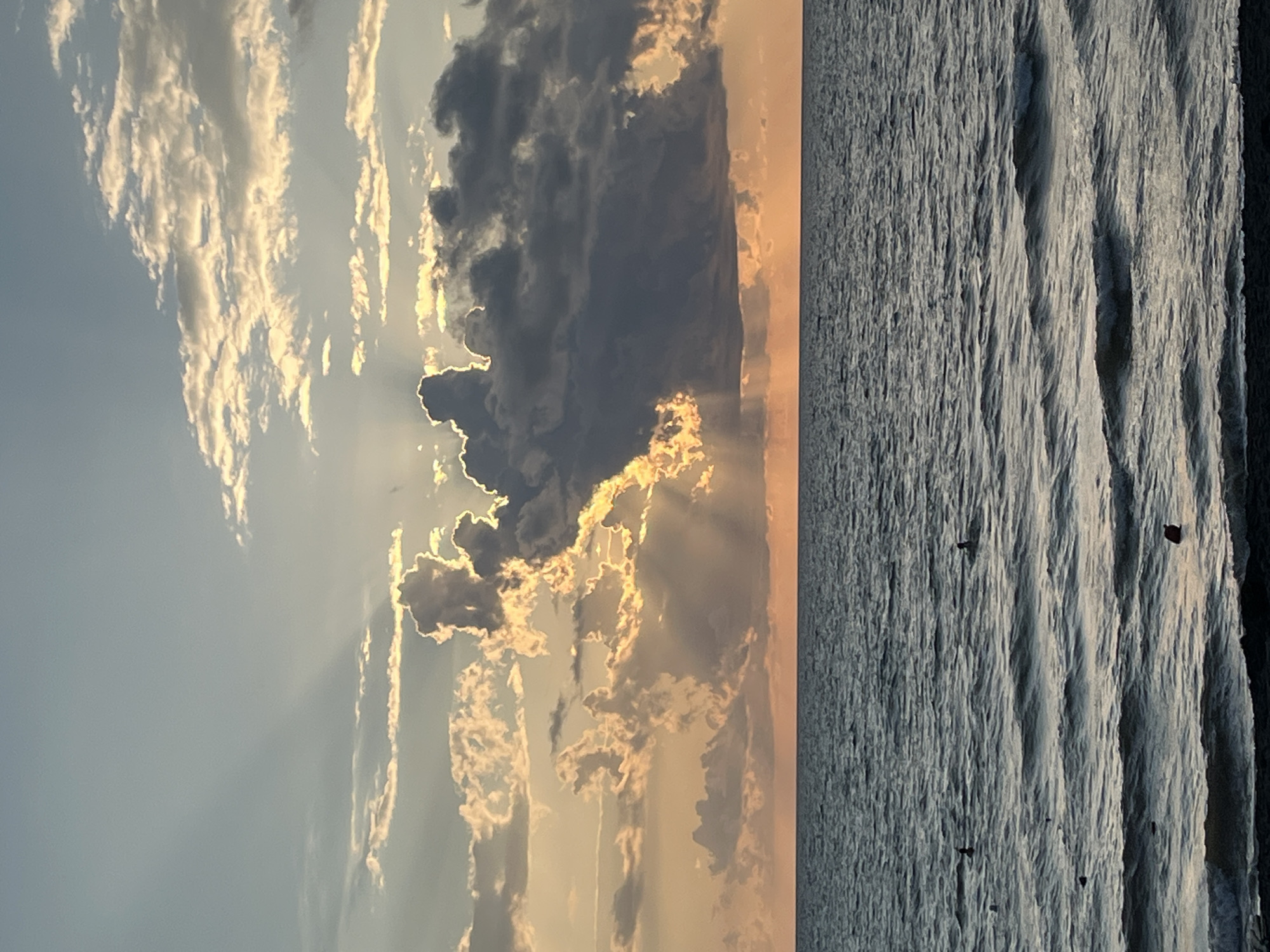 Golden hour on Ureki's black sand beach